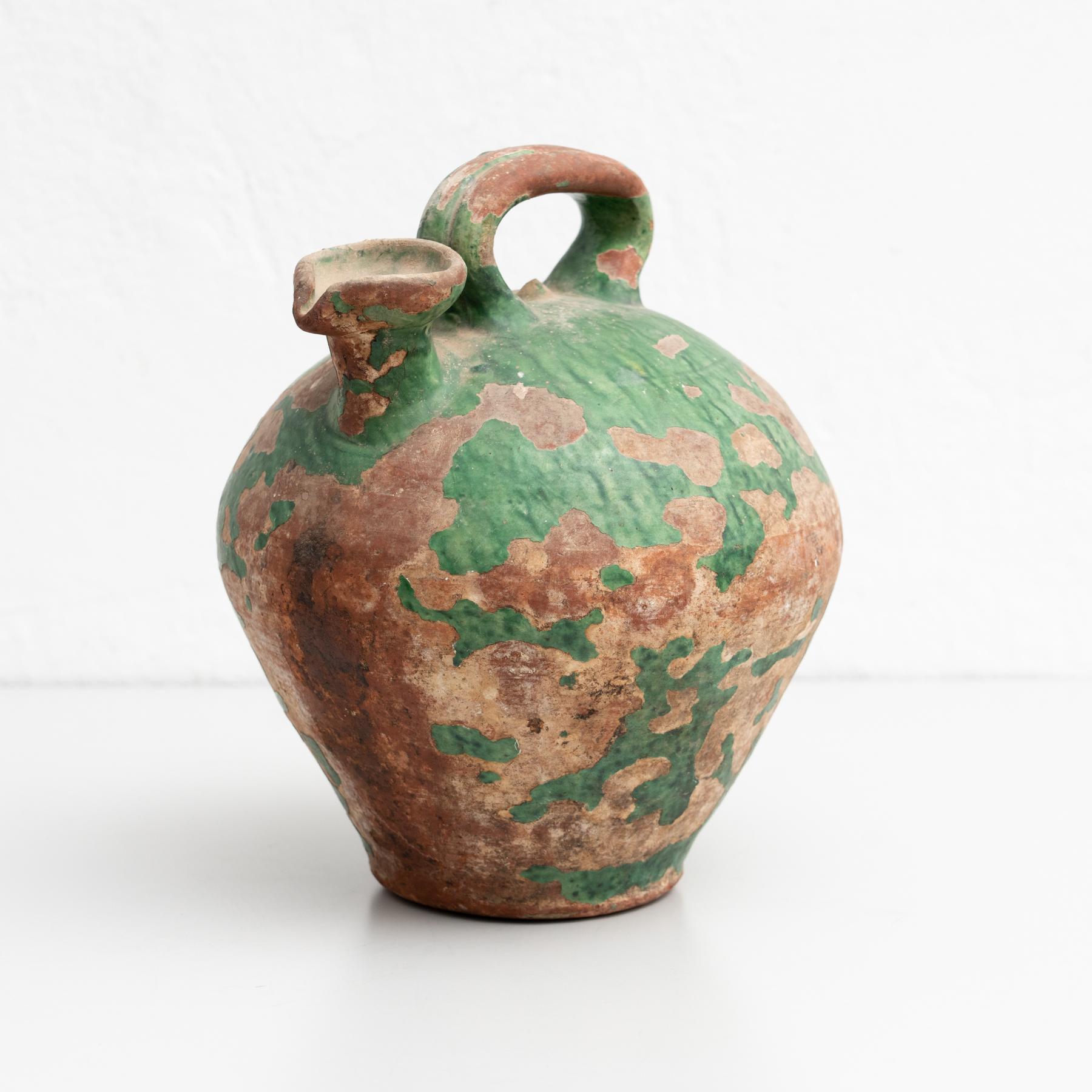 Traditional Spanish water jug vase, circa 1960.  Manufactured in Spain.    In original condition, with minor wear consistent of age and use, preserving a beautiul patina.    Material:  Ceramic.   