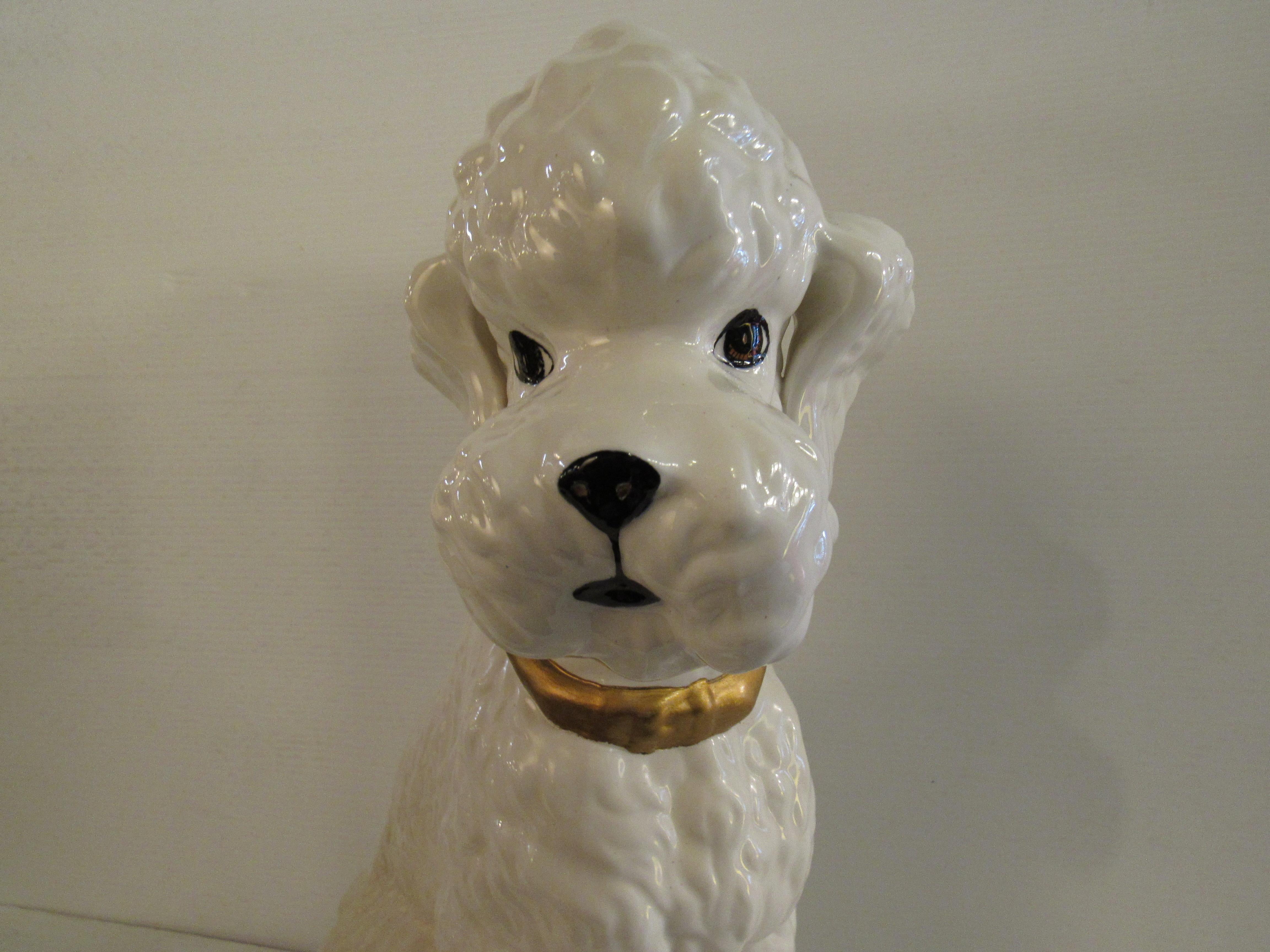 This ceramic poodle sculpture was handmade and signed 