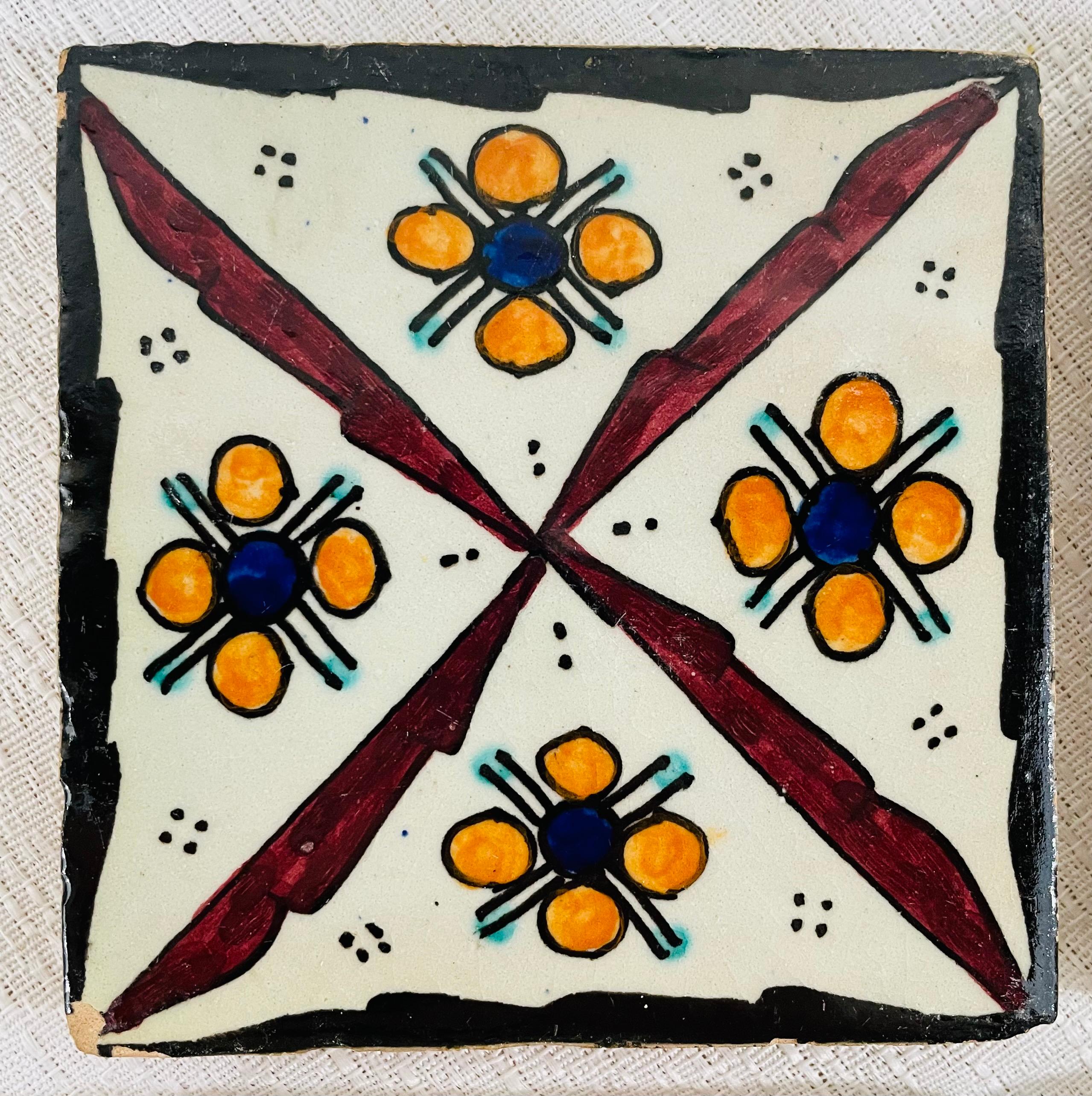A set of four ceramic hand painted Moroccan coasters or tiles featuring lovely geometrical design. 

Dimensions: 4