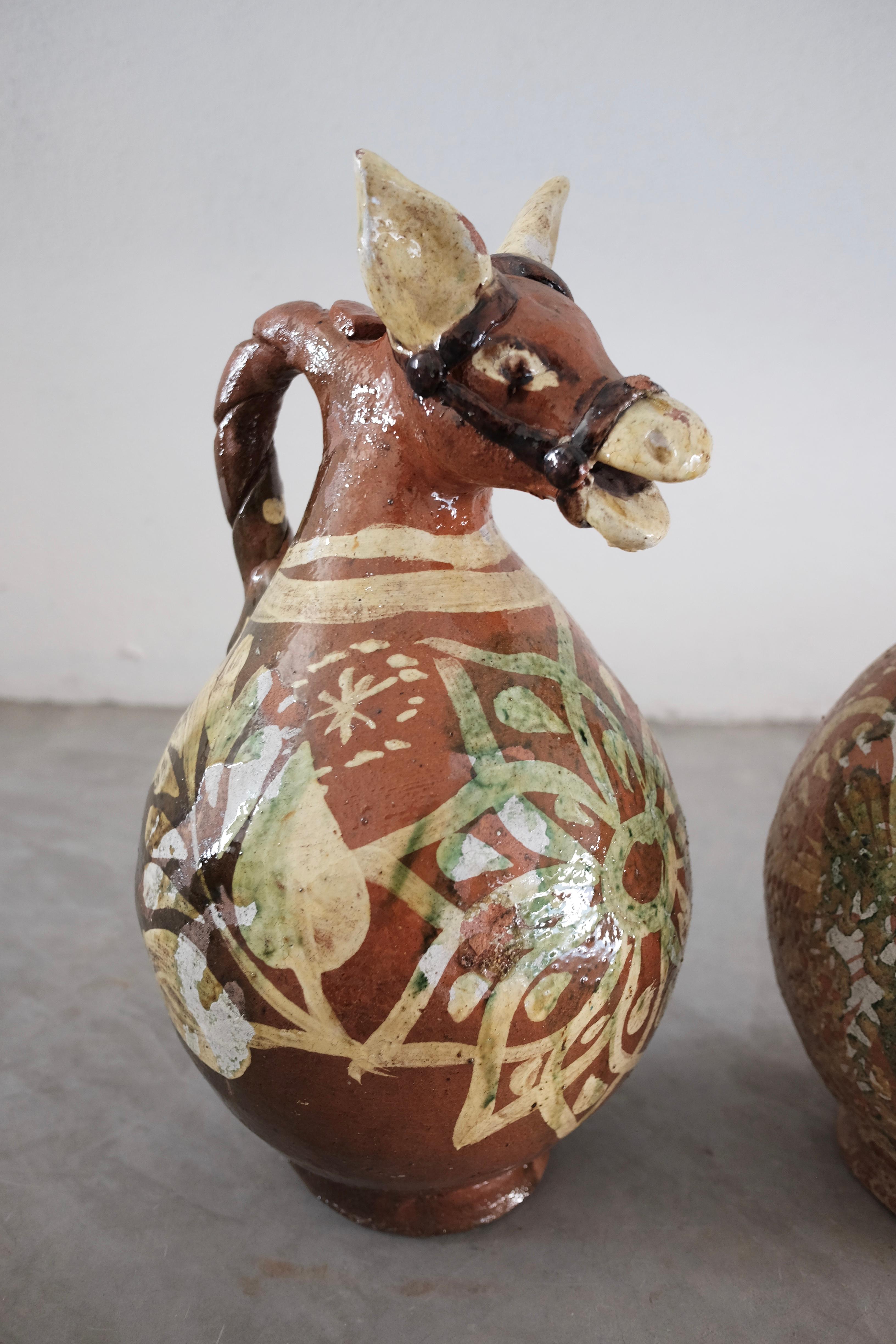 Pair of ceramic horse pitchers once used to serve pulque (fermented agave beverage). Glazed and painted.
