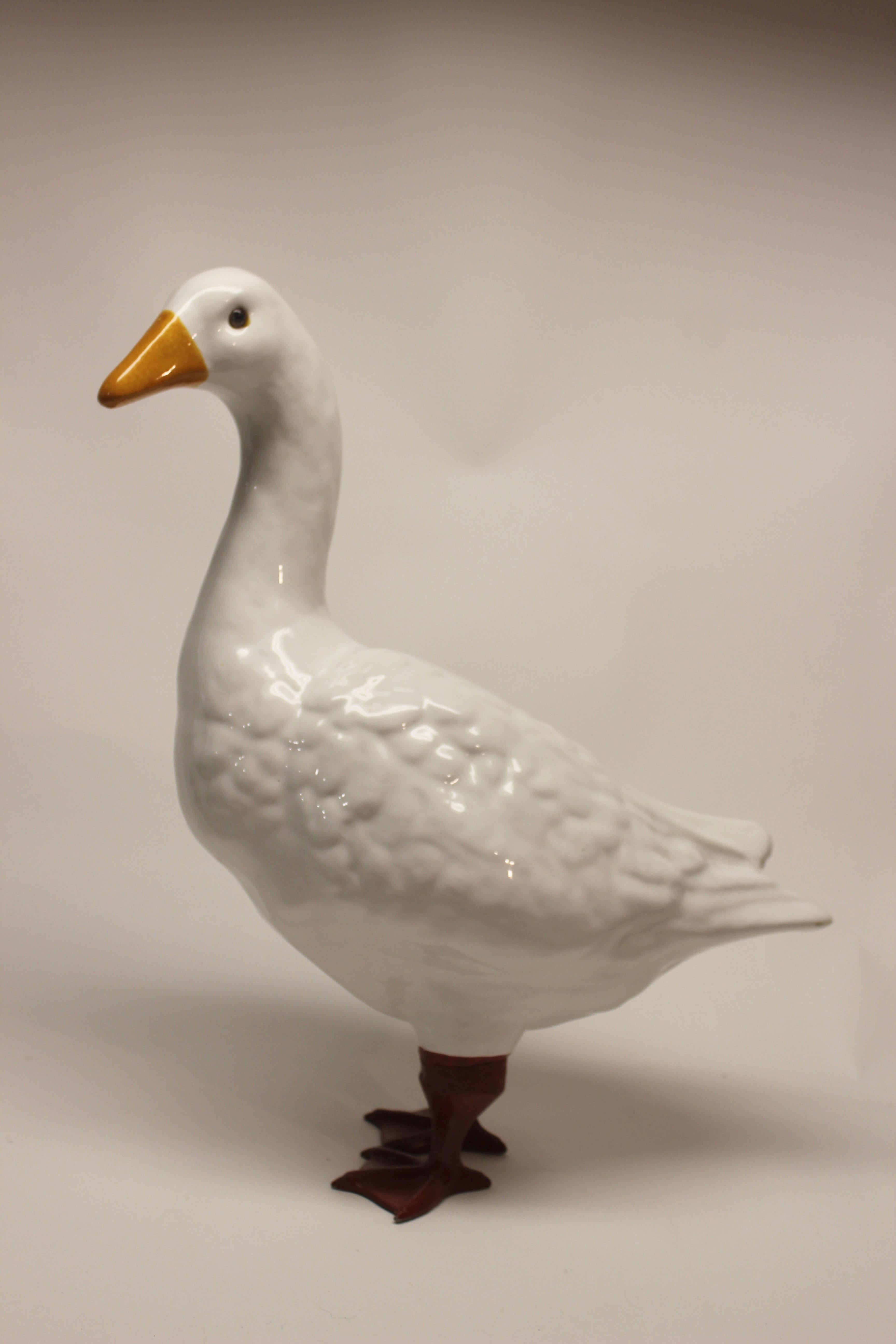 Ceramic Italian goose with metal legs.
