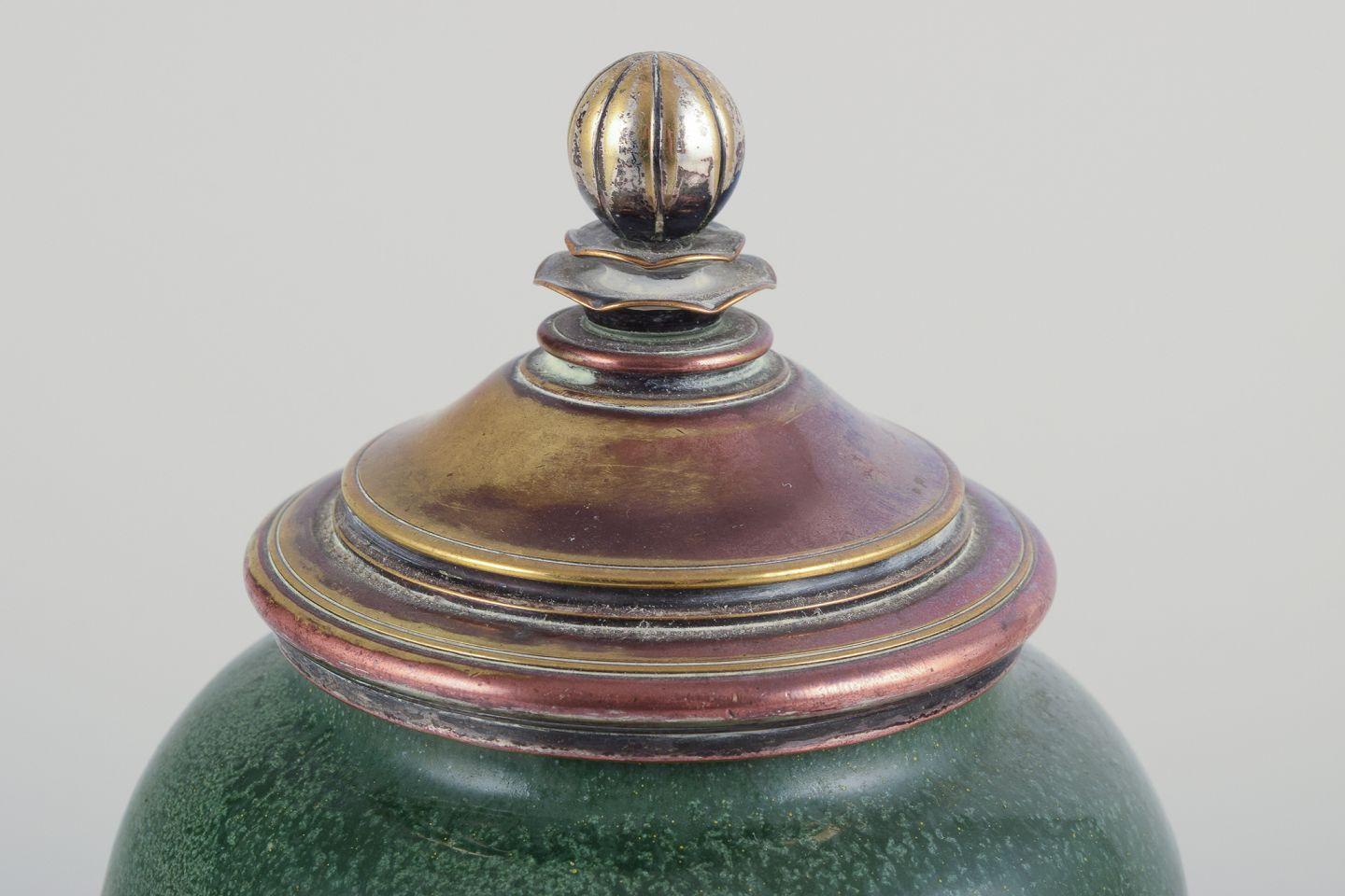 Danish Ceramic jar glazed in green hues. With a brass and bronze lid. For Sale