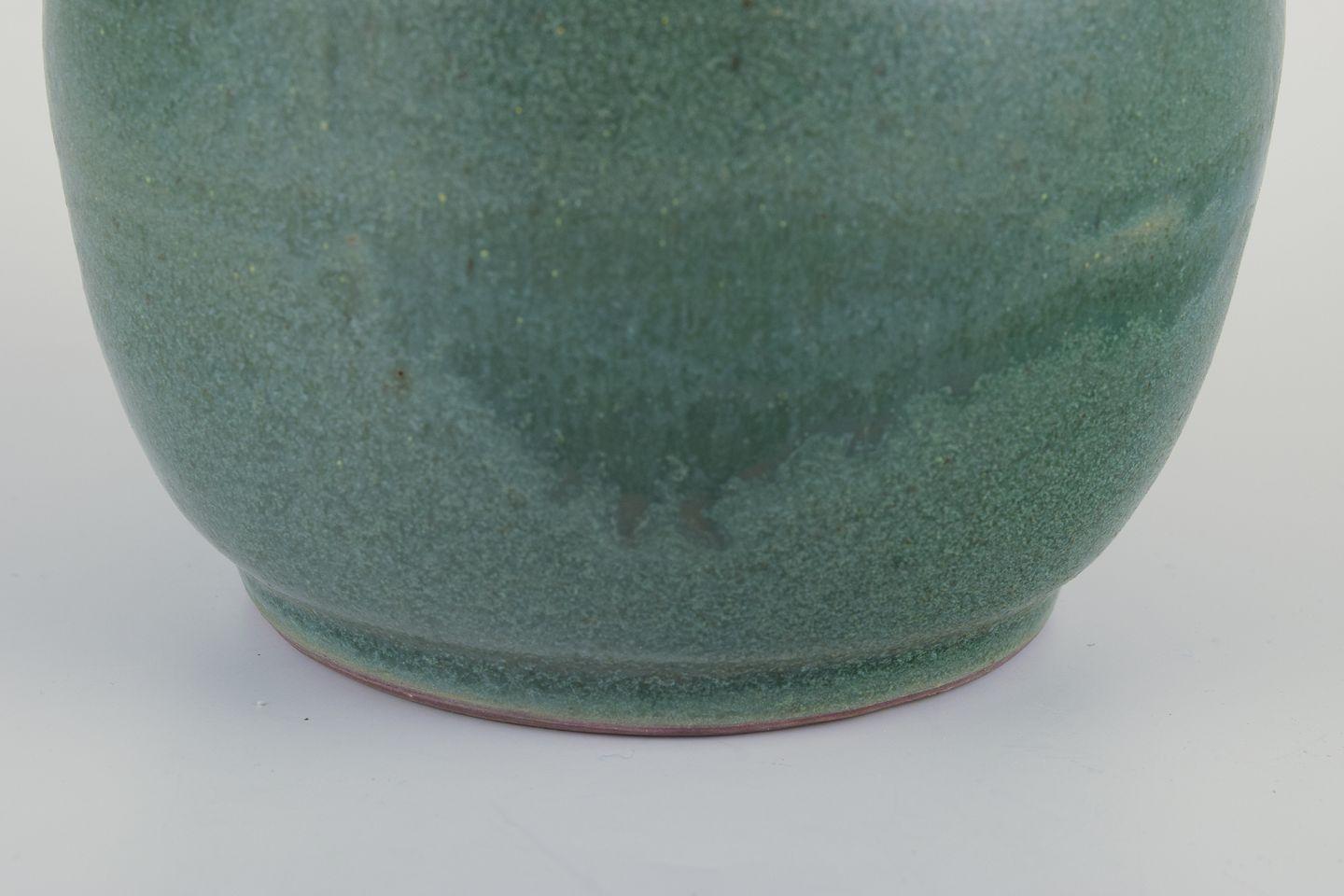 Ceramic jar glazed in green hues. With a brass and bronze lid. In Excellent Condition For Sale In Copenhagen, DK