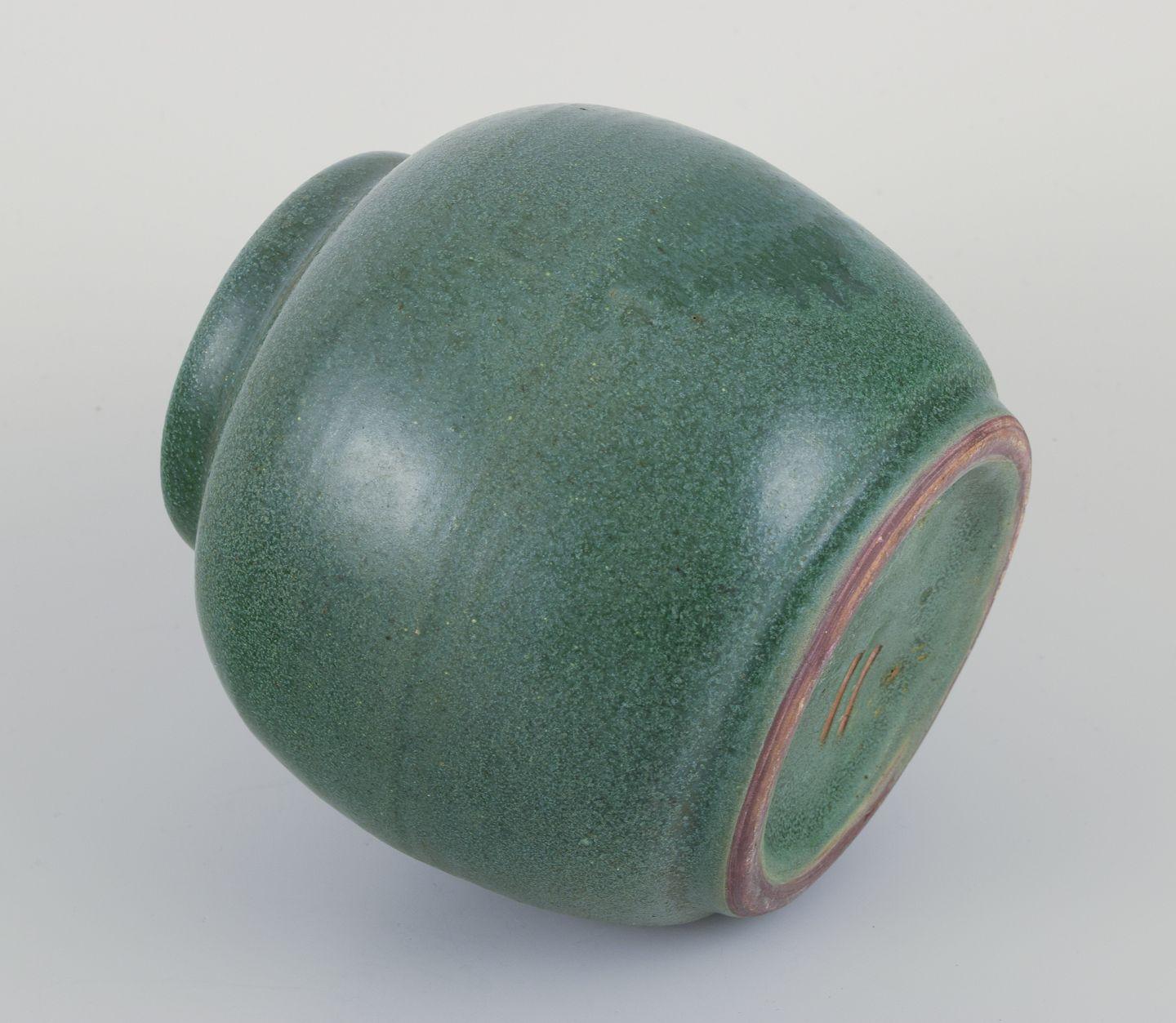Brass Ceramic jar glazed in green hues. With a brass and bronze lid. For Sale