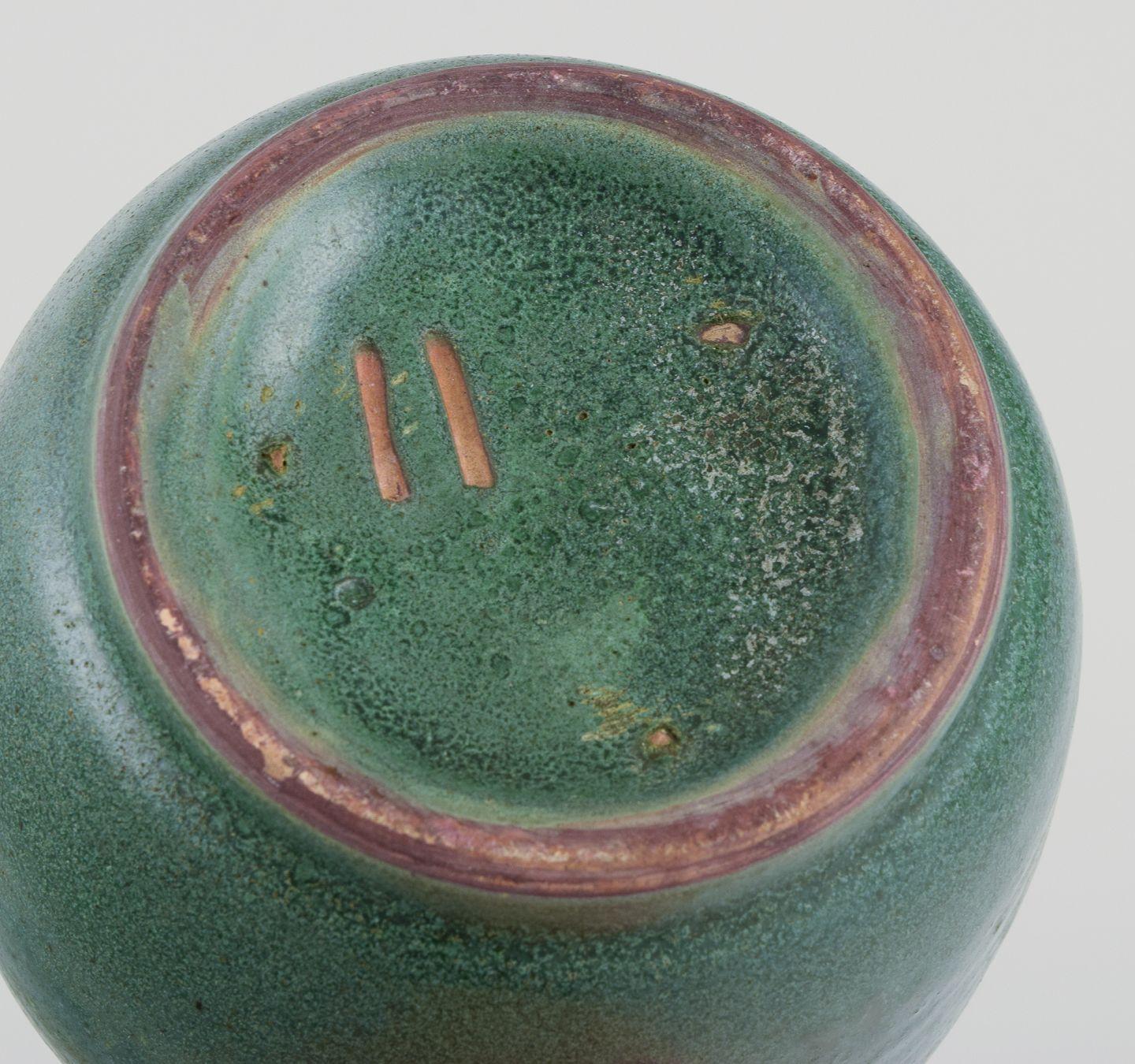 Ceramic jar glazed in green hues. With a brass and bronze lid. For Sale 1