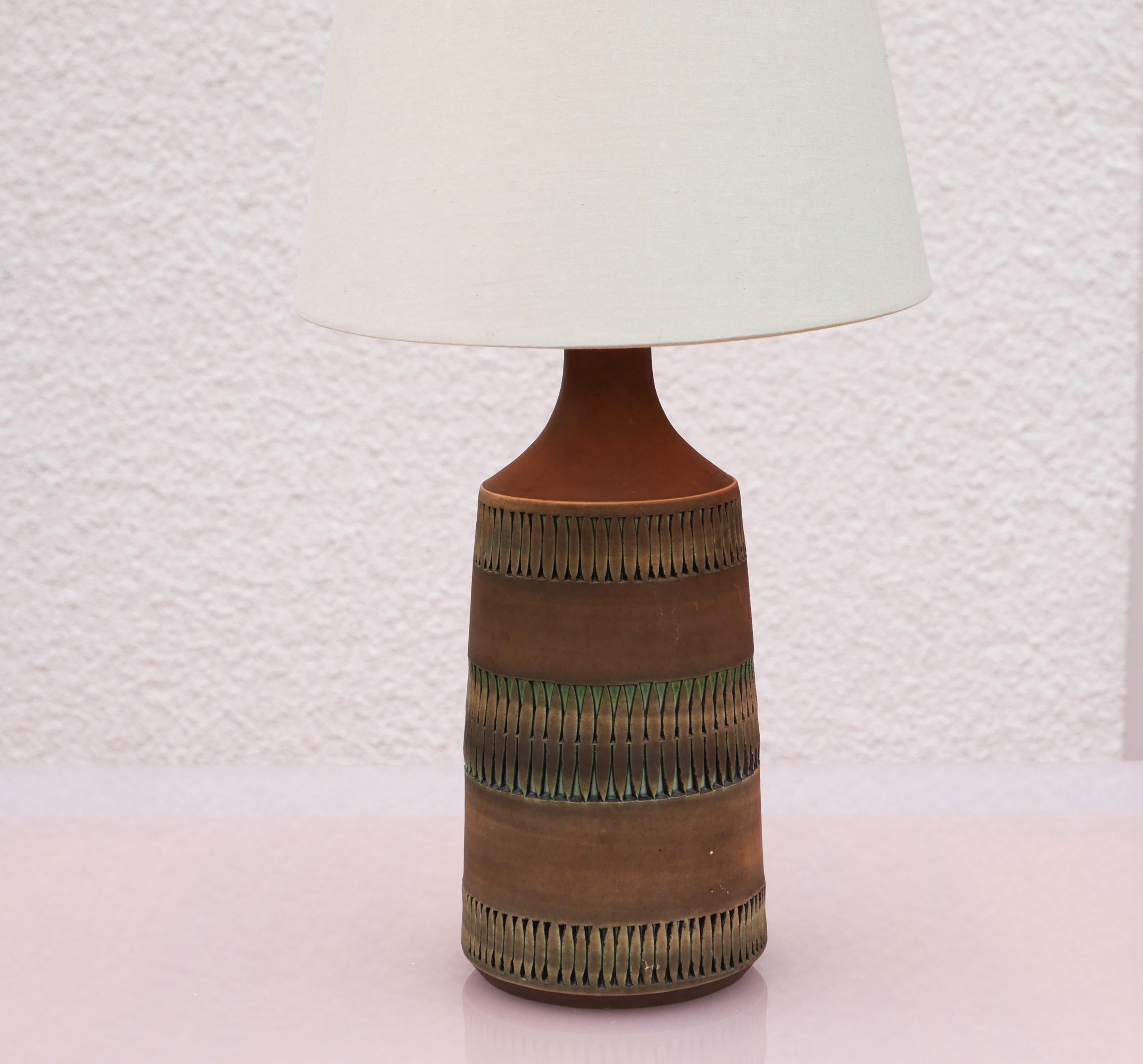 A fantastic rather large vintage ceramic lamp base, handmade from Alingsås Keramik, Sweden. This lamp base is simple in the design, with intricate patterns imbedded and it is all handmade. The patterns are simple, yet it is the colors that makes