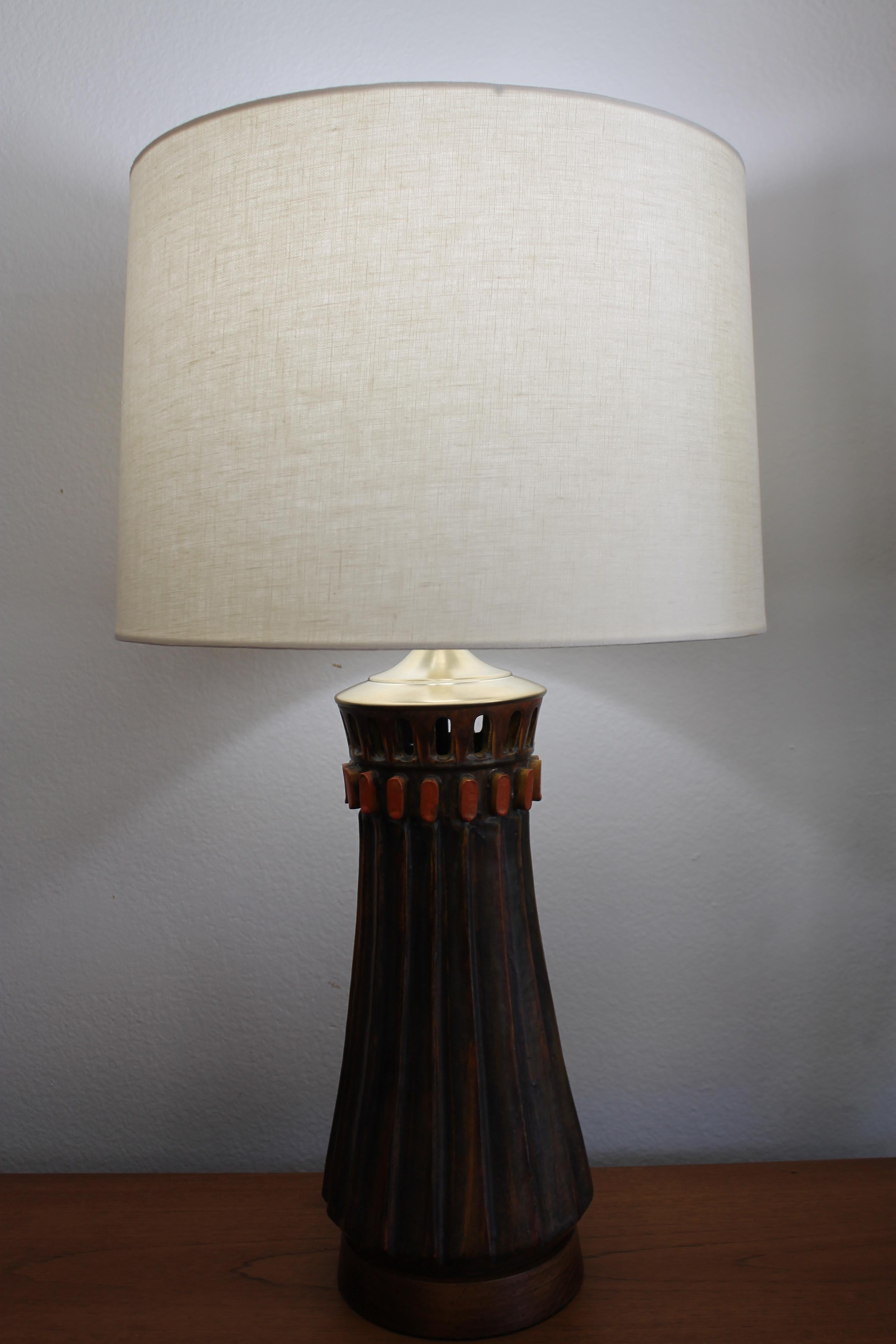 Ceramic table lamp designed by Alvino Bagni and distributed by Raymor. Lamp contains label on base before rewiring. Lamp has been professionally rewired with hi quality brass hardware for a 3-way lightbulb. Ceramic portion measures 14.25