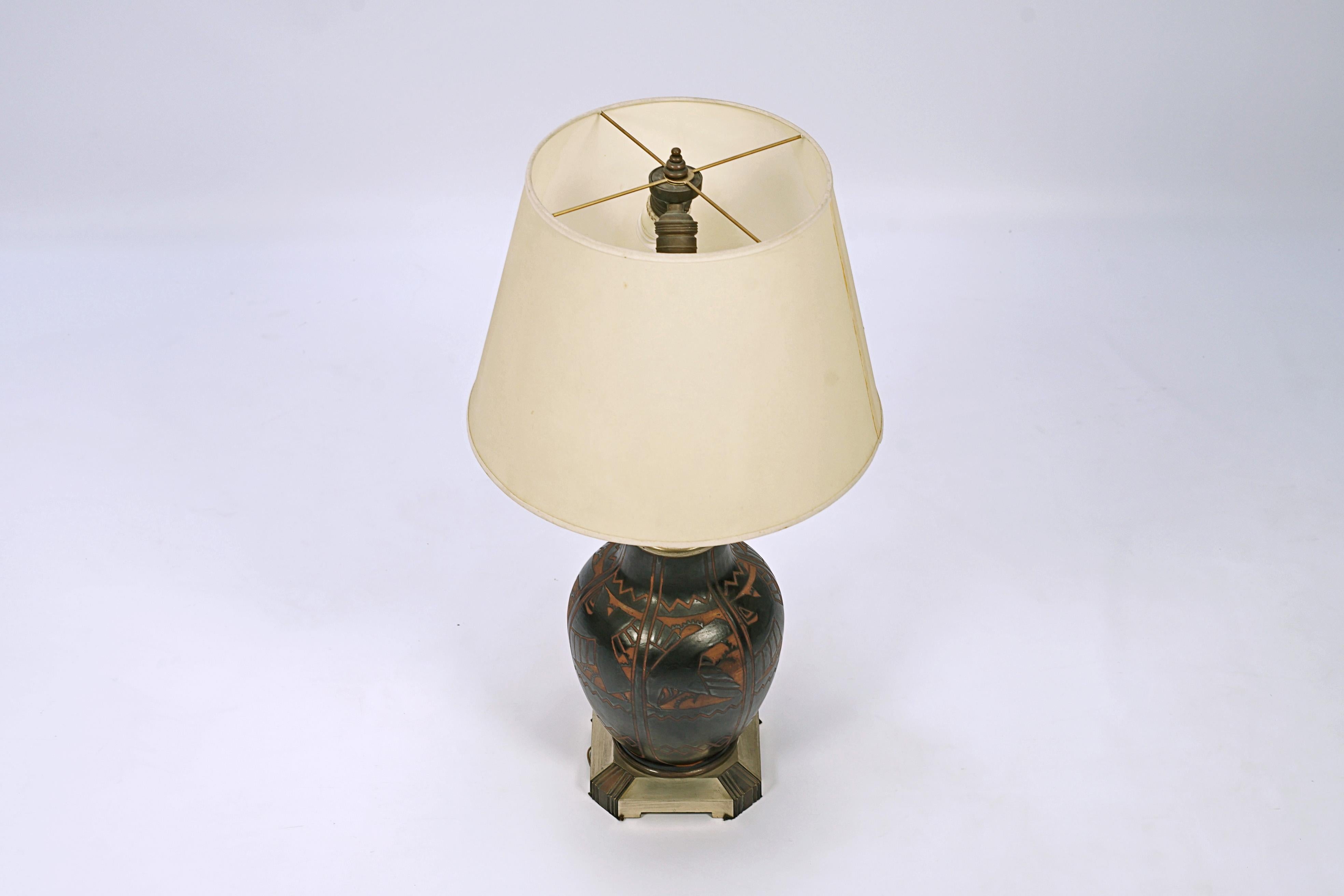 Ceramic lamp by Charles Catteau (1880-1966) and manufactured by Boch (Under the Grès Keramis mark). Design number D.1009.

Belgium, CIRCA 1925.