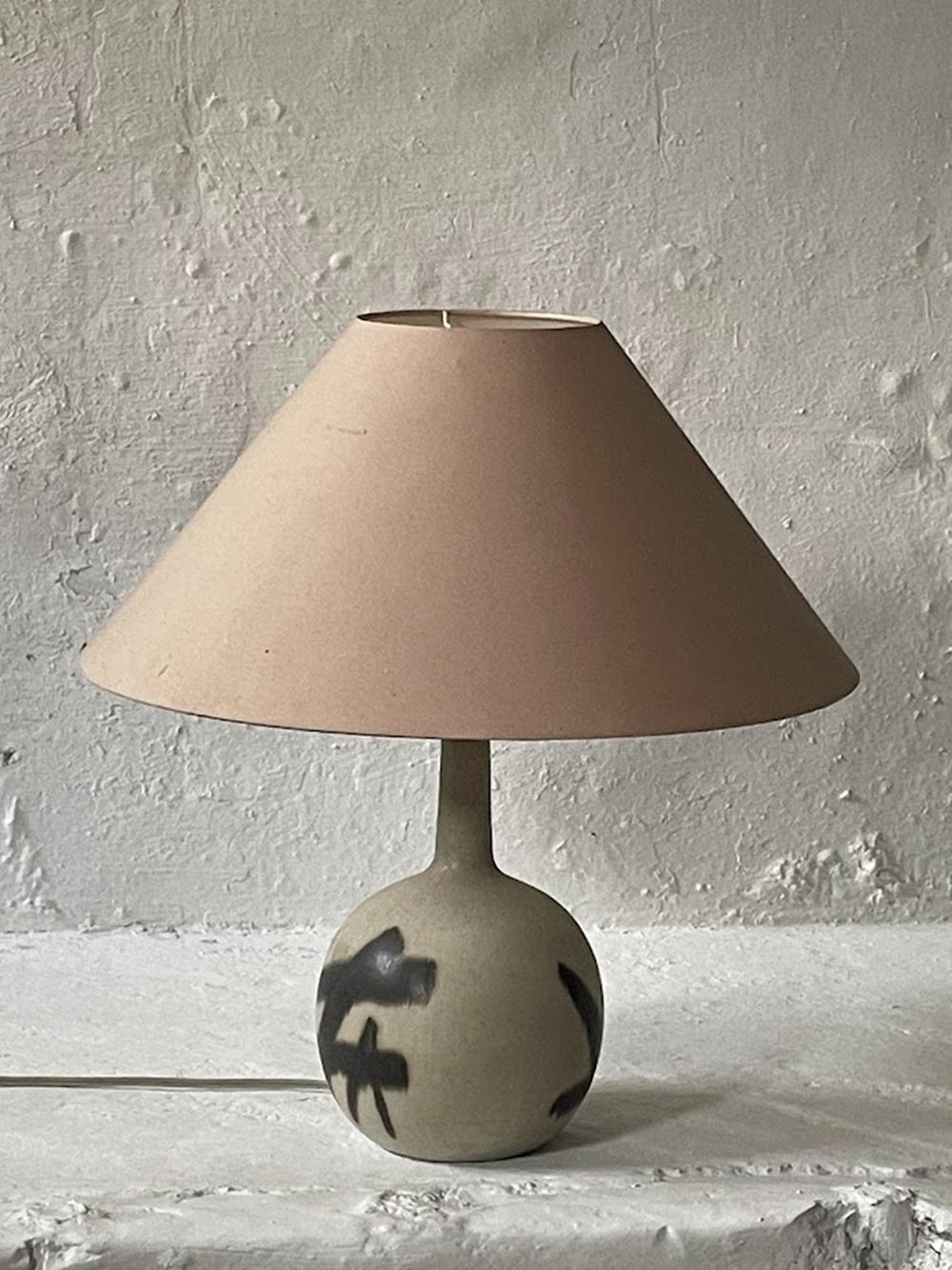 Original ceramic table lamp designed by Eigil Hinrichsen, dating back to the 1960s from Denmark. This unique piece beautifully combines Scandinavian modernism with Japanese-inspired design, featuring a smooth, earthy glaze and striking black