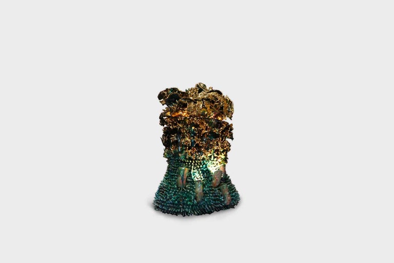 Ceramic vase model “Fallen Chandelier”
Manufactured by Virginia Leonard 
New Zealand, 2021 
Clay, resin, pure gold, LED light

Virginia Leonard holds that she feasts upon the process and change, enhancing the organic reality of her body, its