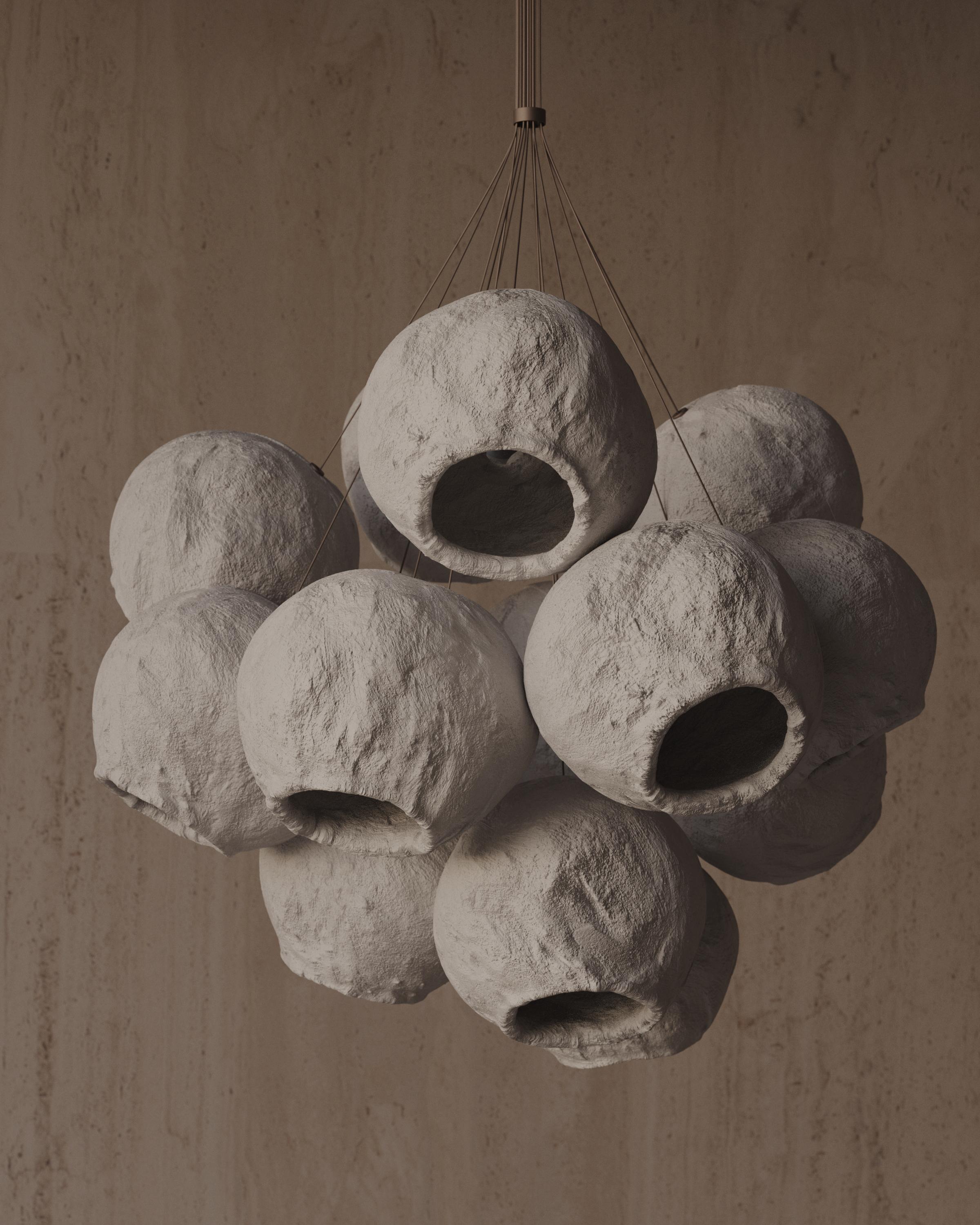 Is a tribute to Ukrainian aesthetics. More than ten individual
ceramic shining spheres are assembled into a delicious cluster that
radiates light in all directions, thus creating a sophisticated lighting
design. The name translates as 