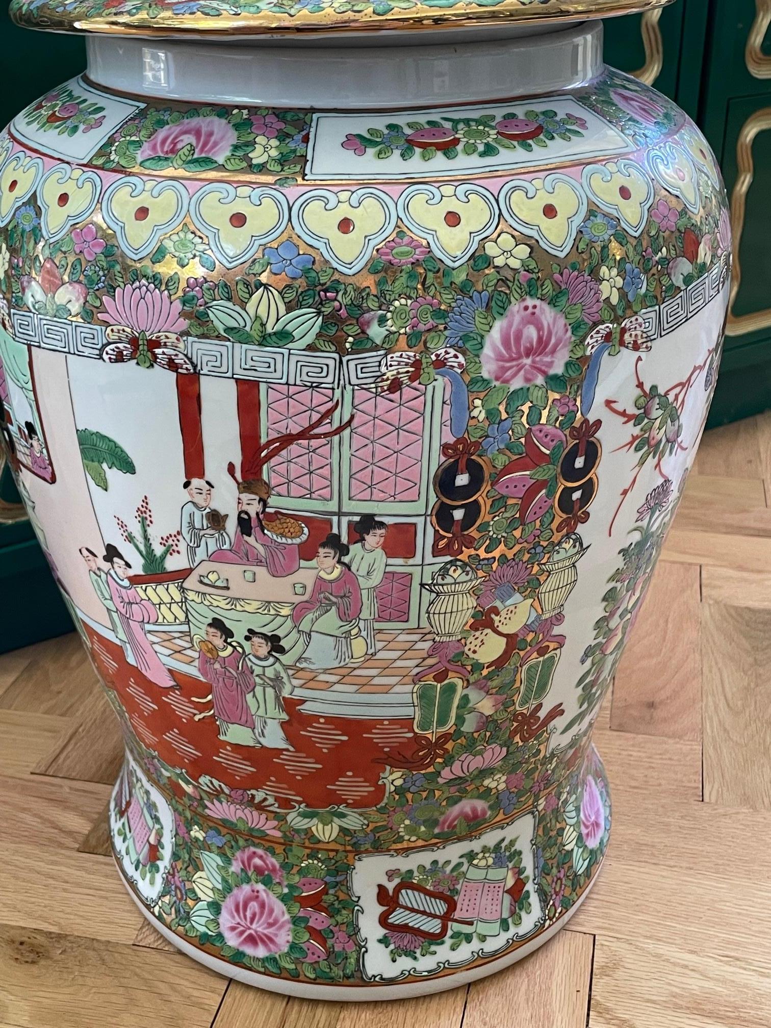 Large ceramic floor vase or urn features Chinese chinoiserie hand painted body and lid, depicting Oriental scenes along with birds and flora. Domed lid features a gold foo dog as handle. Maker's mark present on bottom. Near excellent condition with