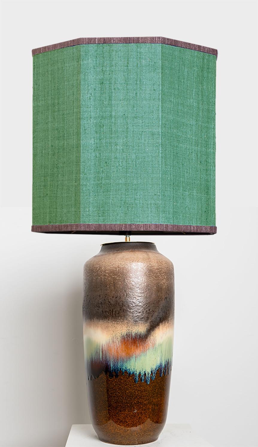 A rare large ceramic table lamp from late-20th century. Sculptural piece, made of handmade ceramic elements in brown tones with beautiful accent colours. With a special custom made lamp shade by René Houben. More options available see also the in a