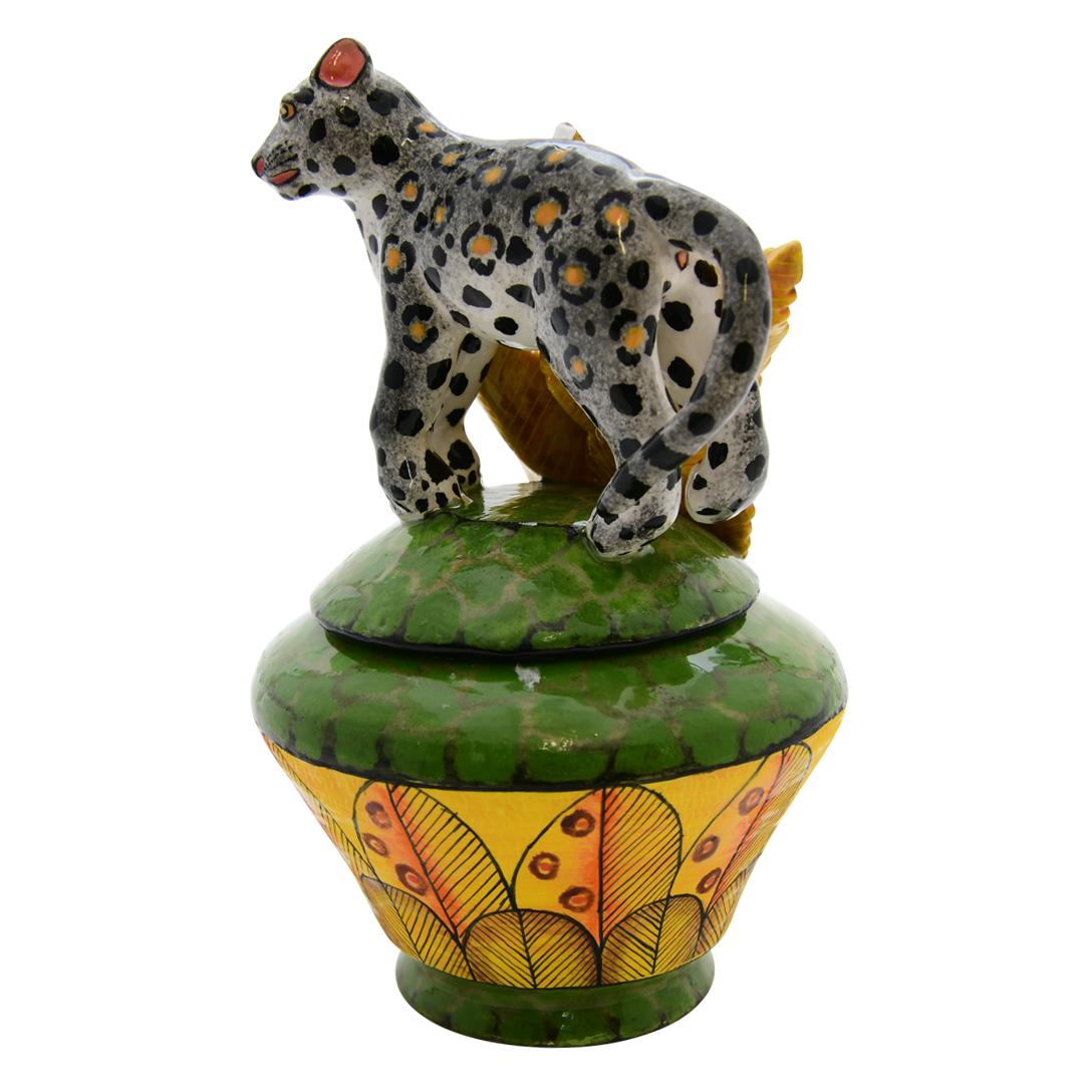Crafted with passion by Motsomay and Sabelo at Love Art Ceramic in South Africa, this Leopard jewelry box is a stunning embodiment of African culture. The ceramic piece, measuring 4 inches high, 5 inches long, and 5 inches wide, captures the grace