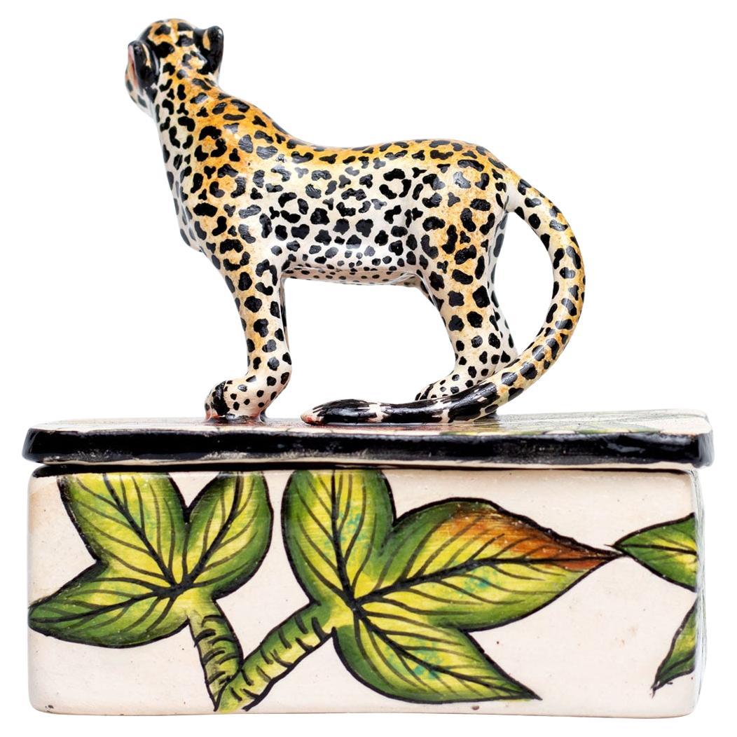 Introducing the striking ceramic Tiger jewelry box, a unique creation from Imvelo Natural Art, South Africa. Hand-painted by Samukelo Gumede and hand-sculpted by Bennet Zondo, this piece measures 5 inches high, 4 inches in length, and 4 inches in