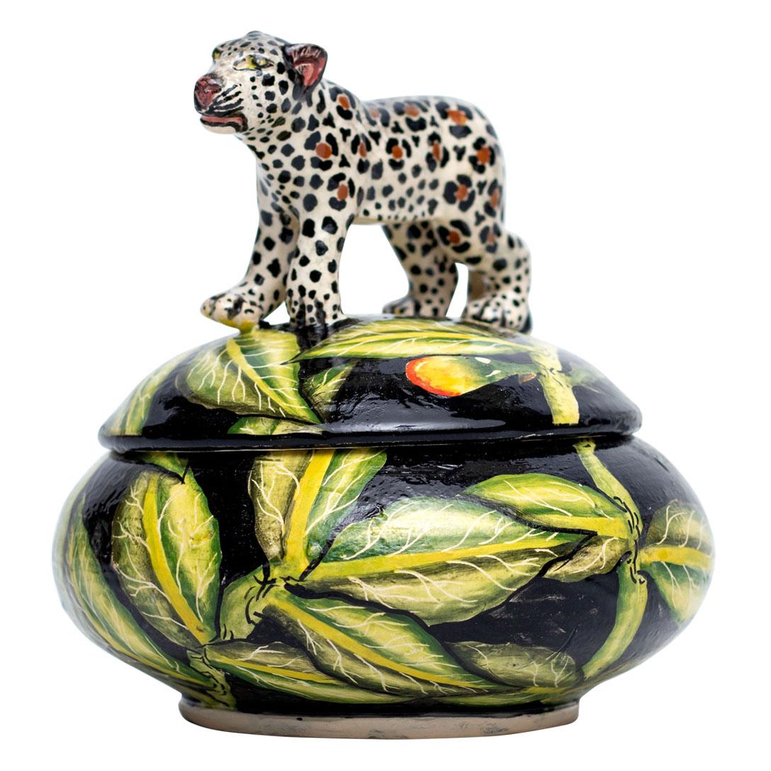 Introducing the striking ceramic Leopard jewelry box, a unique creation from Imvelo Natural Art, South Africa. Expertly hand-sculpted by Bennet Zondo and hand-painted by Samukelo Gumede, this piece measures 4 inches high, 4 inches in length, and 4