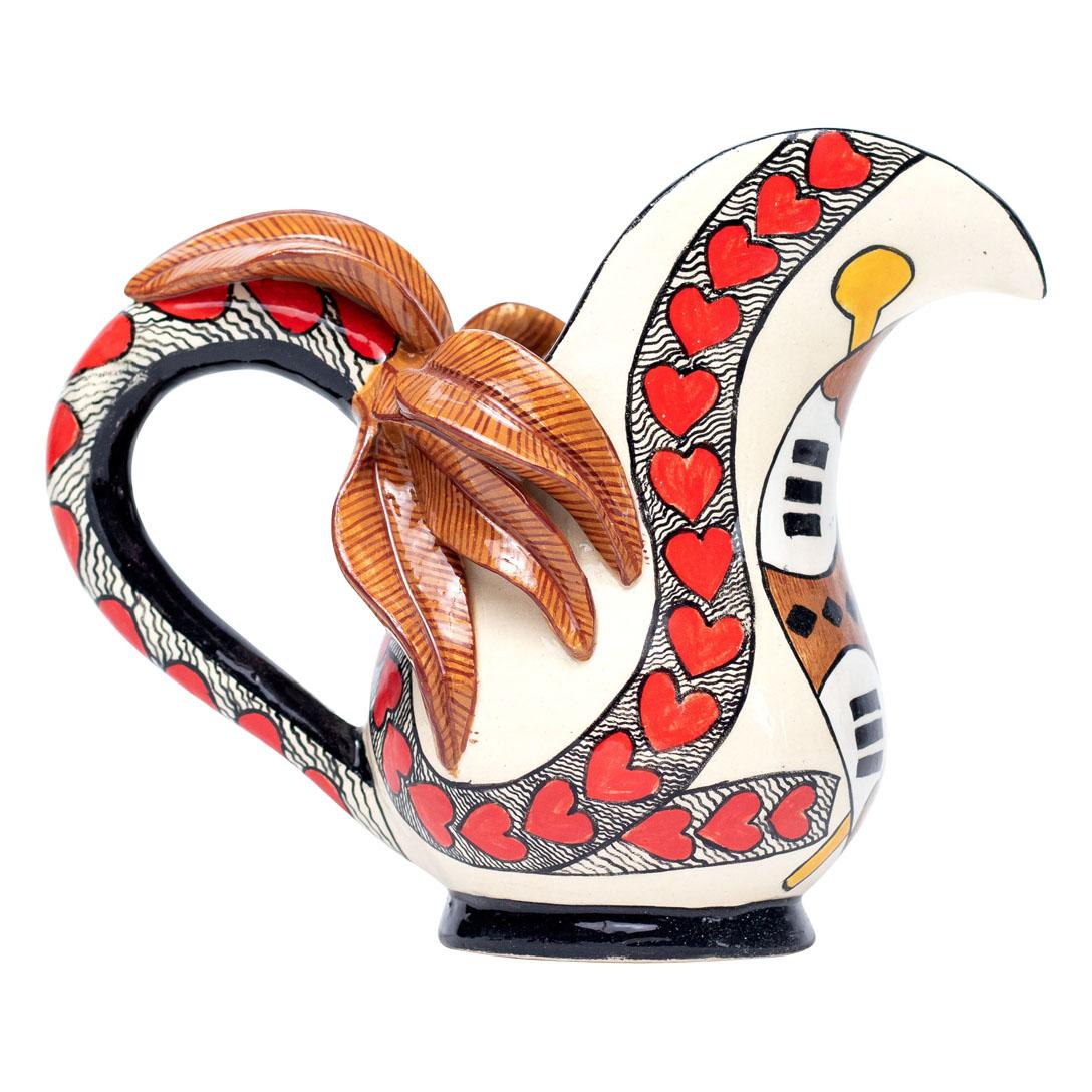 Love Jug Hand Painted by Sli Mazibuko and Sculpted by Sbusiso Ndaba
Embrace the spirit of South Africa with the enchanting Love Jug, a stunning piece of ceramic art from Love Art Ceramic. Expertly sculpted by Sbusiso Ndaba and beautifully