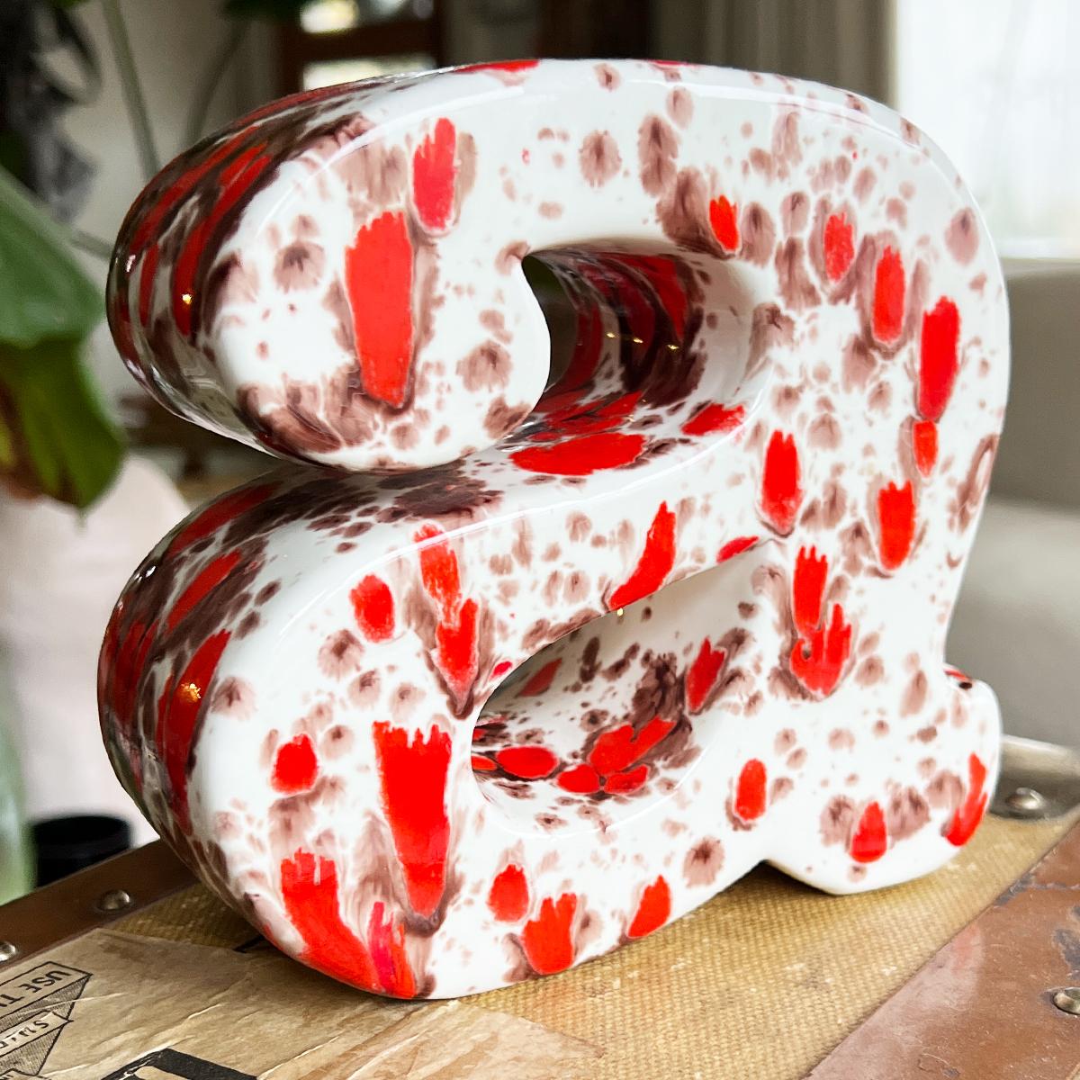 American Ceramic Lowercase Letter A Splatter Painted Bookend in Orange and Brown - 1981 For Sale
