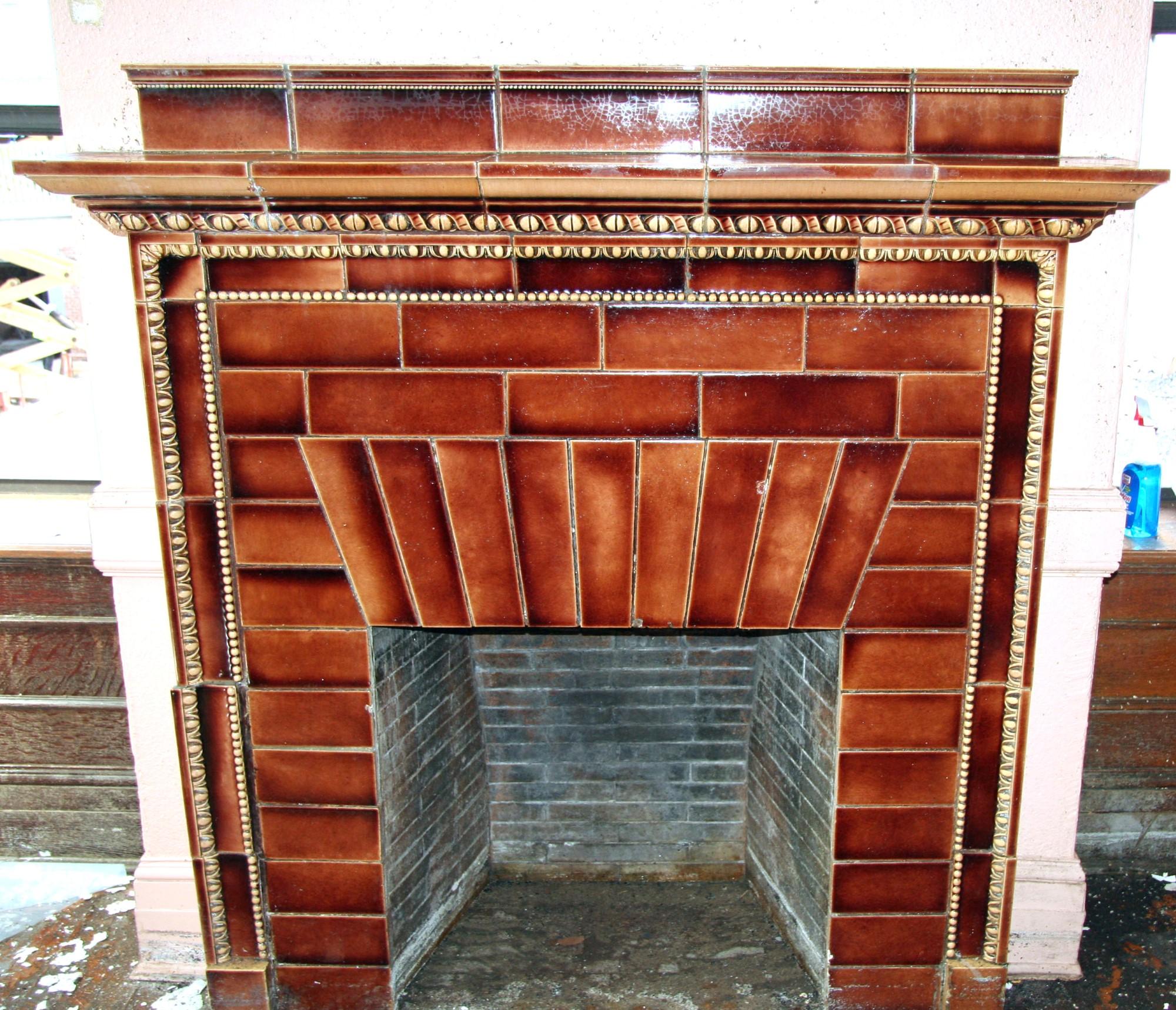 A very beautiful ceramic tile mantel. We salvaged this ceramic mantel out of the famous Iver Johnson building in Fitchburg, MA. Thick and big with original crackling. These ceramic mantels were manufactured by the Hartford Faience Co. of Hartford,