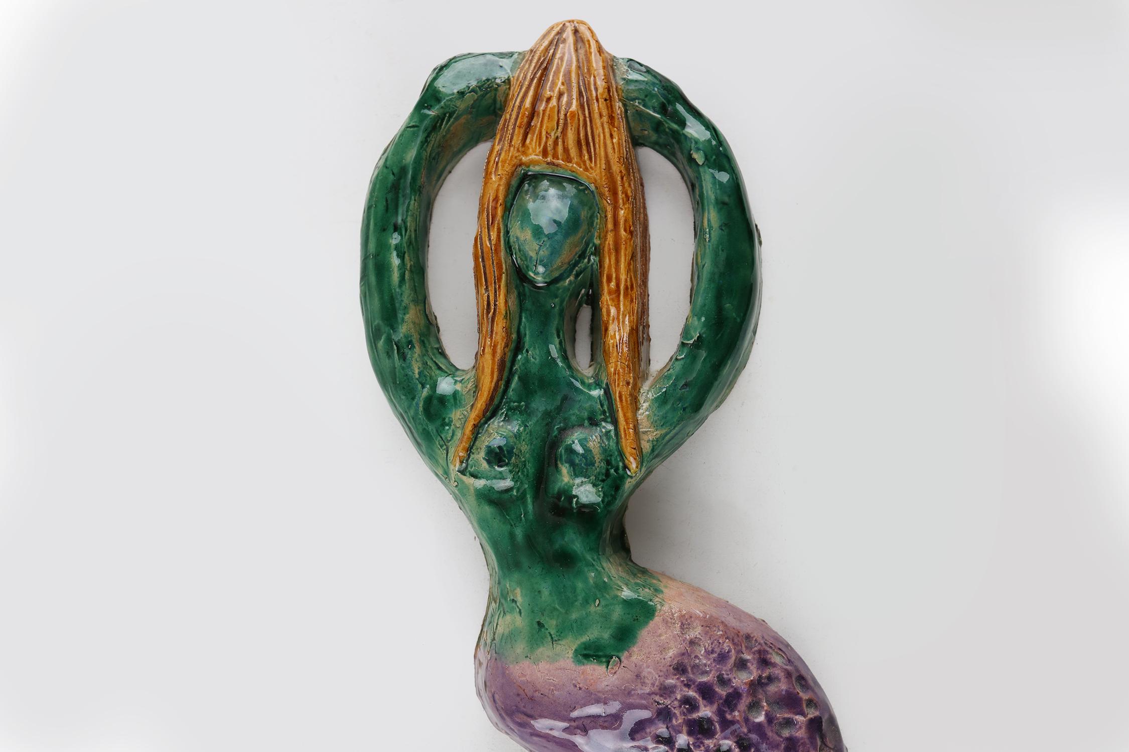 Beautiful ceramic mermaid with some great colors.