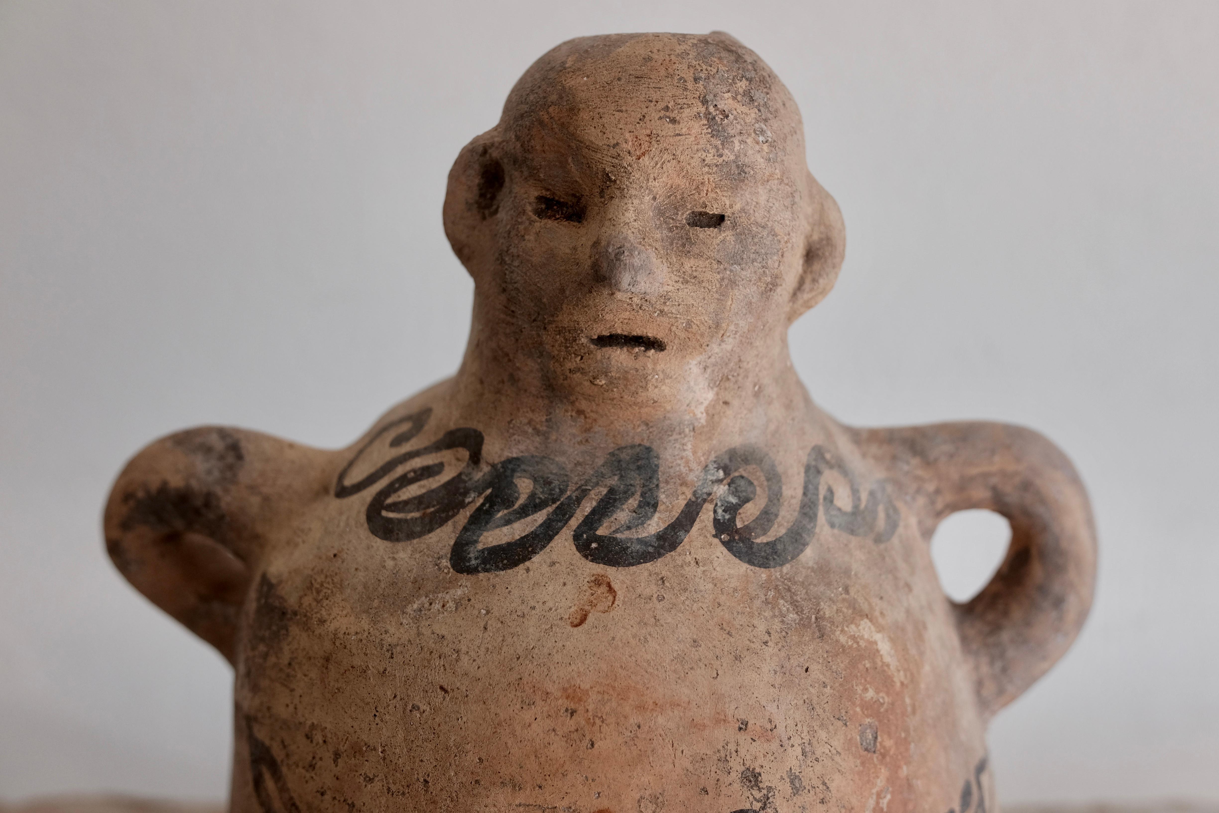 Ceramic Mezcal Jug from Tuliman, Guerrero. The pitcher-like vessel has been repaired on its left arm rung by a leading ceramicist in the area. Rare and unusual piece.