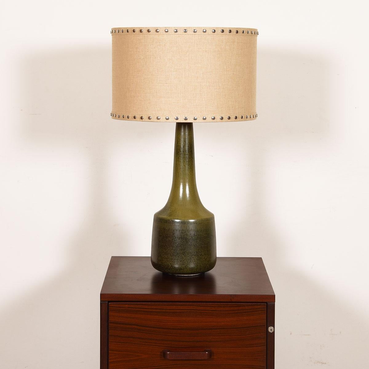 Ceramic midcentury Table Lamp by Bostlund

Additional information:
Material: Ceramic
Featured at Kensington
From Bostlund of Sweden, the beautiful form and beautiful medium mossy green finish on the pottery combine to make this a gracious lamp