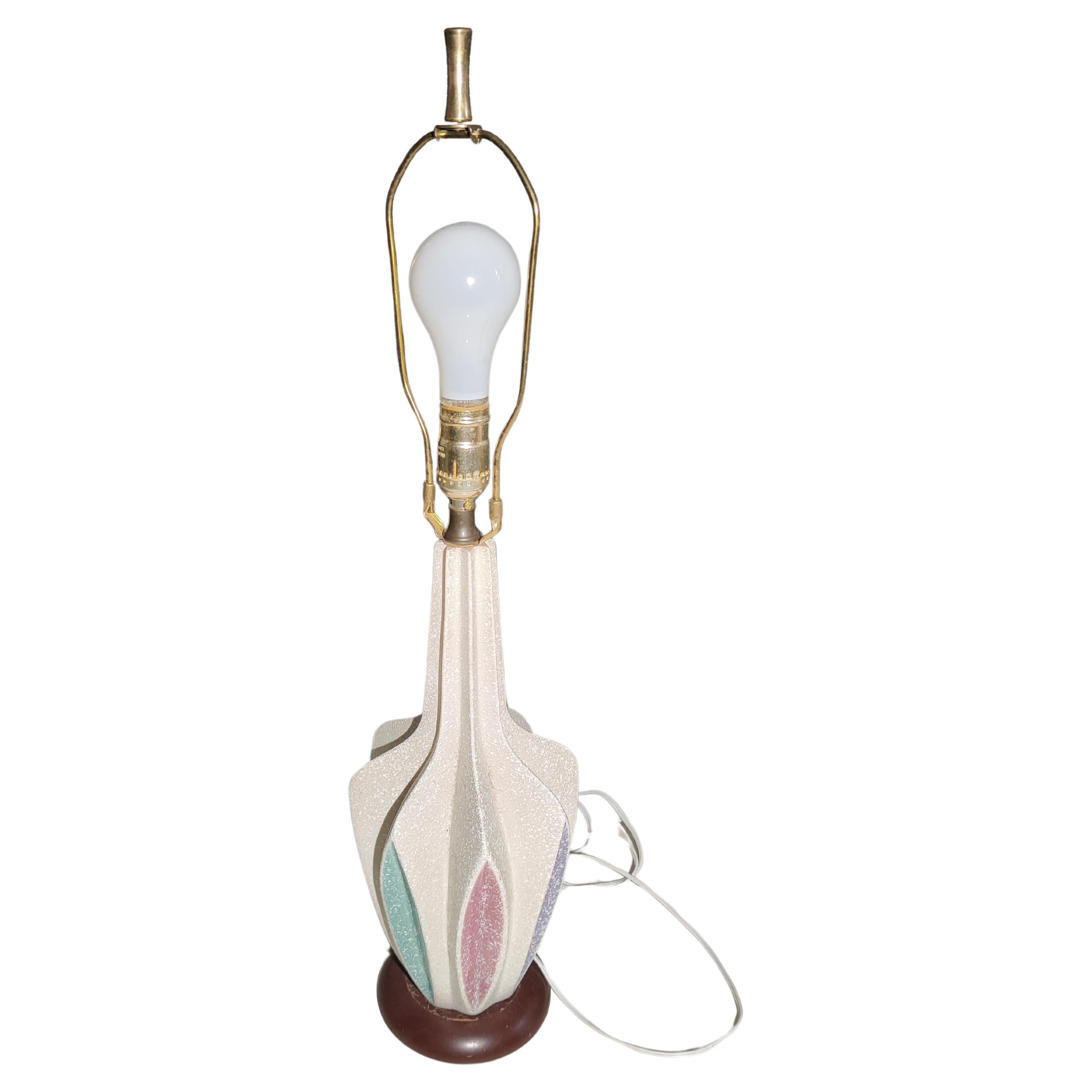 Ceramic mid-century table lamp with multi-color accents.