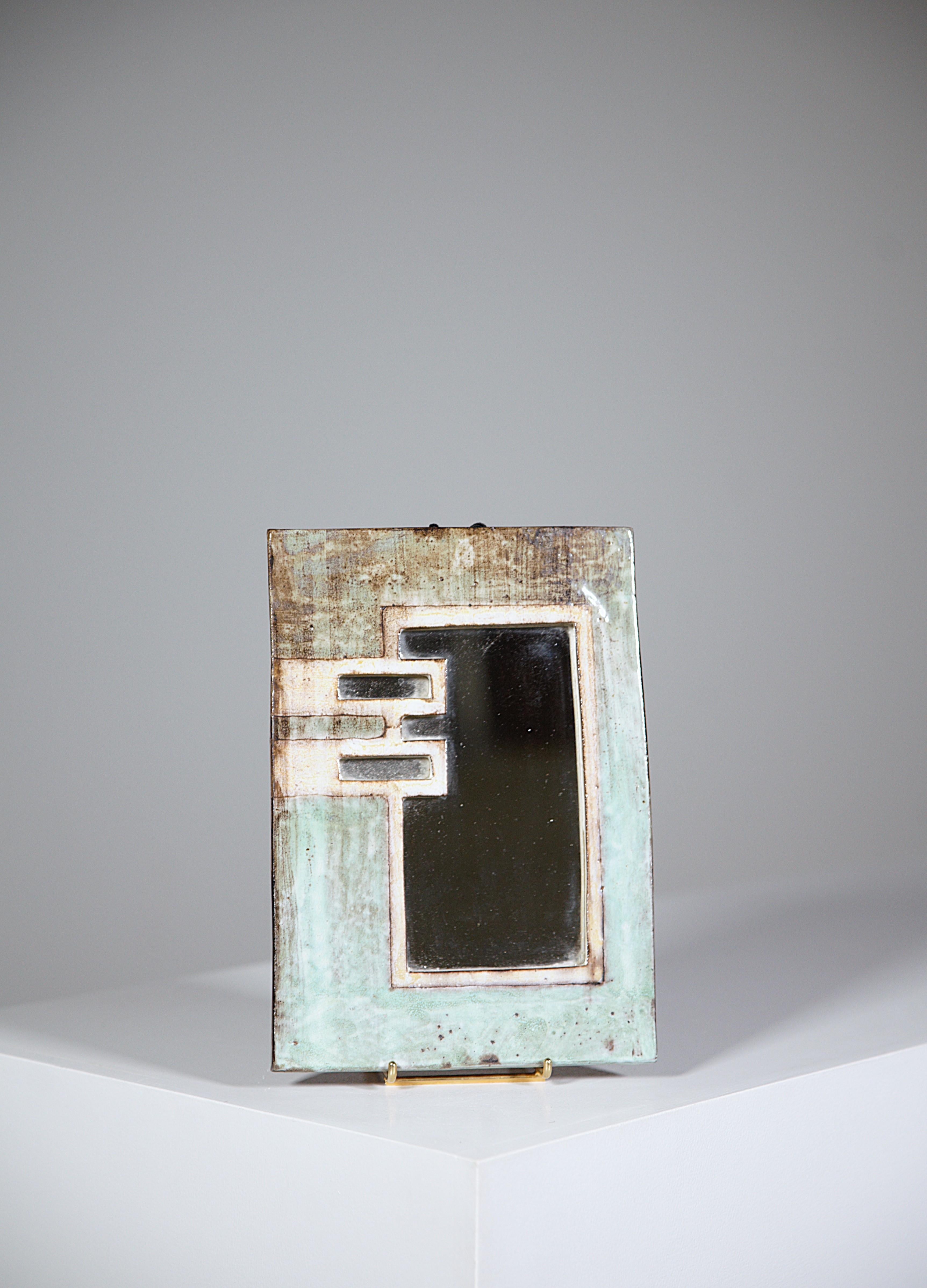 A pareclose mirror by Jean Claude Malarmey.

Vallauris France 1970s.

Signed 