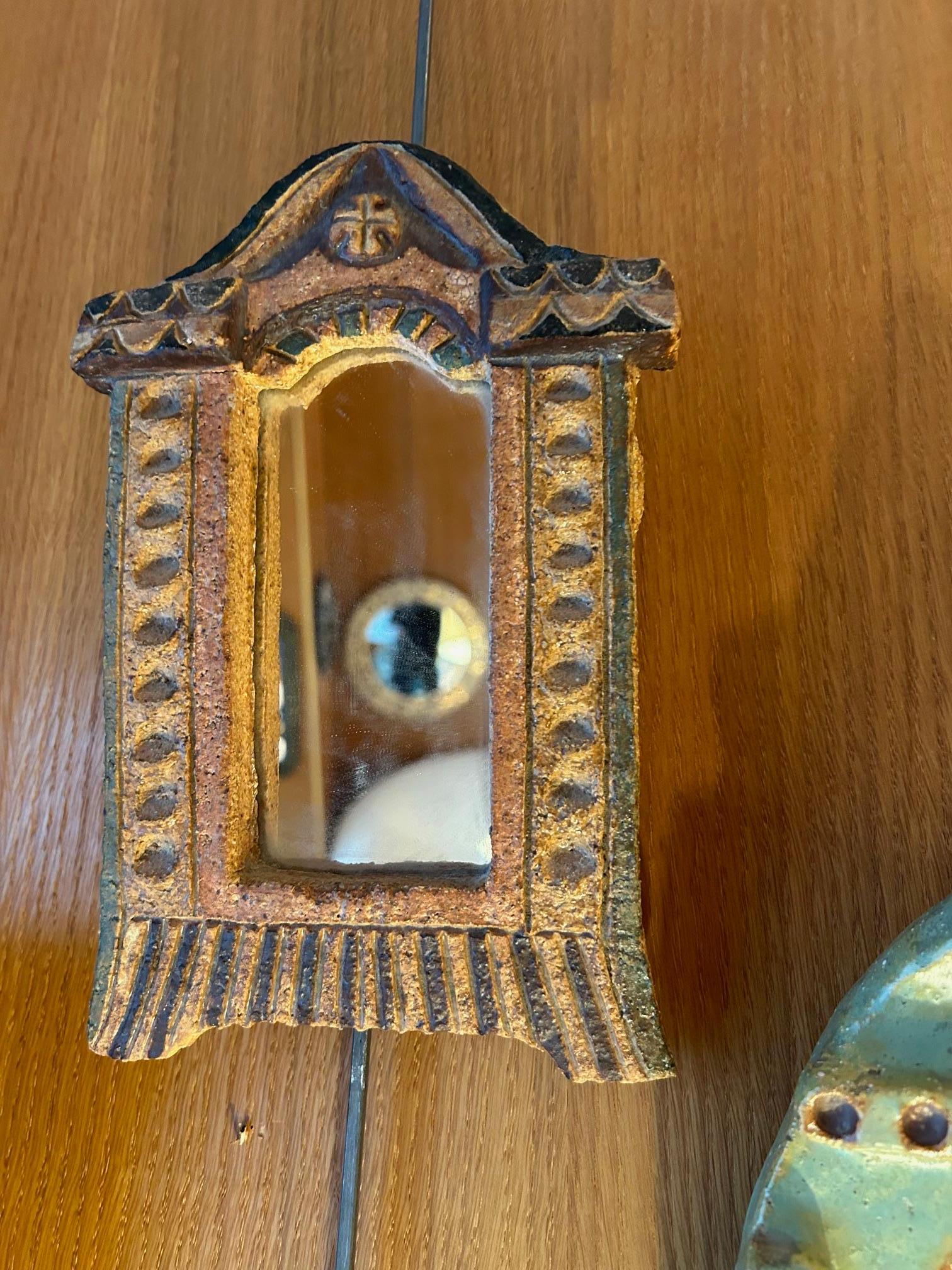 Ceramic mirror by Les Argonautes
1960's
Signed on the back