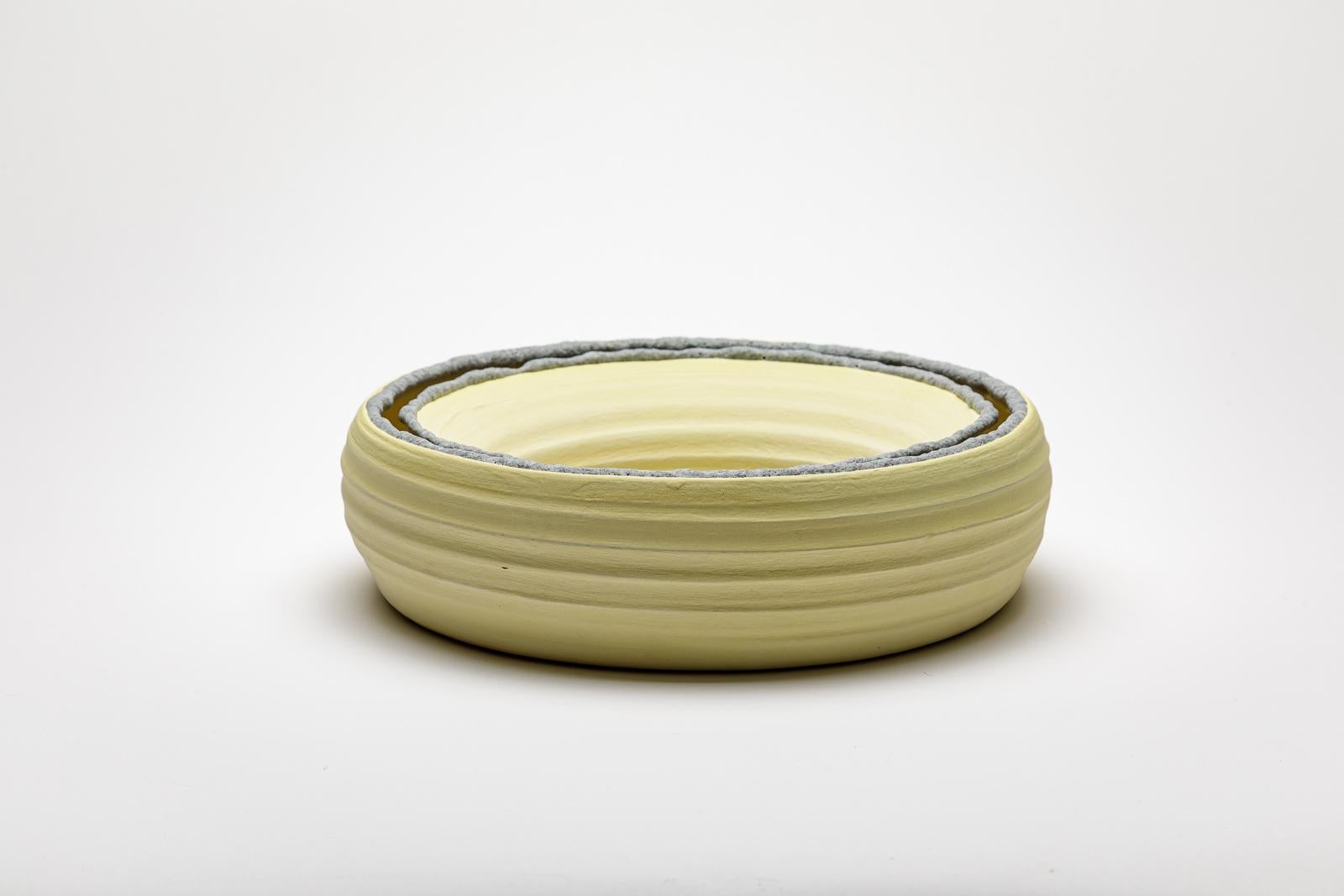 Yellow glazed ceramic mirror by Mia Jensen.
Artist signature under the base. Circa 2023-2024.
H : 3.1’ x 10.2’ inches.
