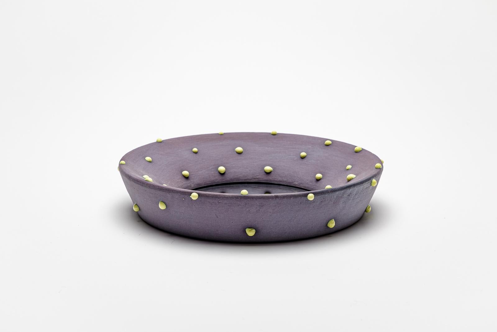Purple glazed ceramic mirror with yellow dots by Mia Jensen.
Artist signature under the base. Circa 2023-2024.
H : 1.6’ x 8.5’ inches.