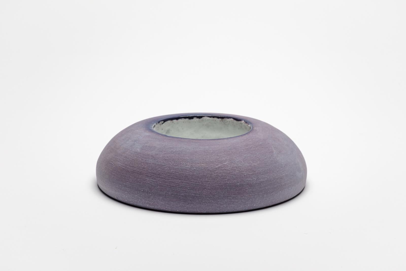 Purple and white glazed ceramic mirror by Mia Jensen.
Artist signature under the base. Circa 2023-2024.
H : 1.9’ x 7.5’ inches.

