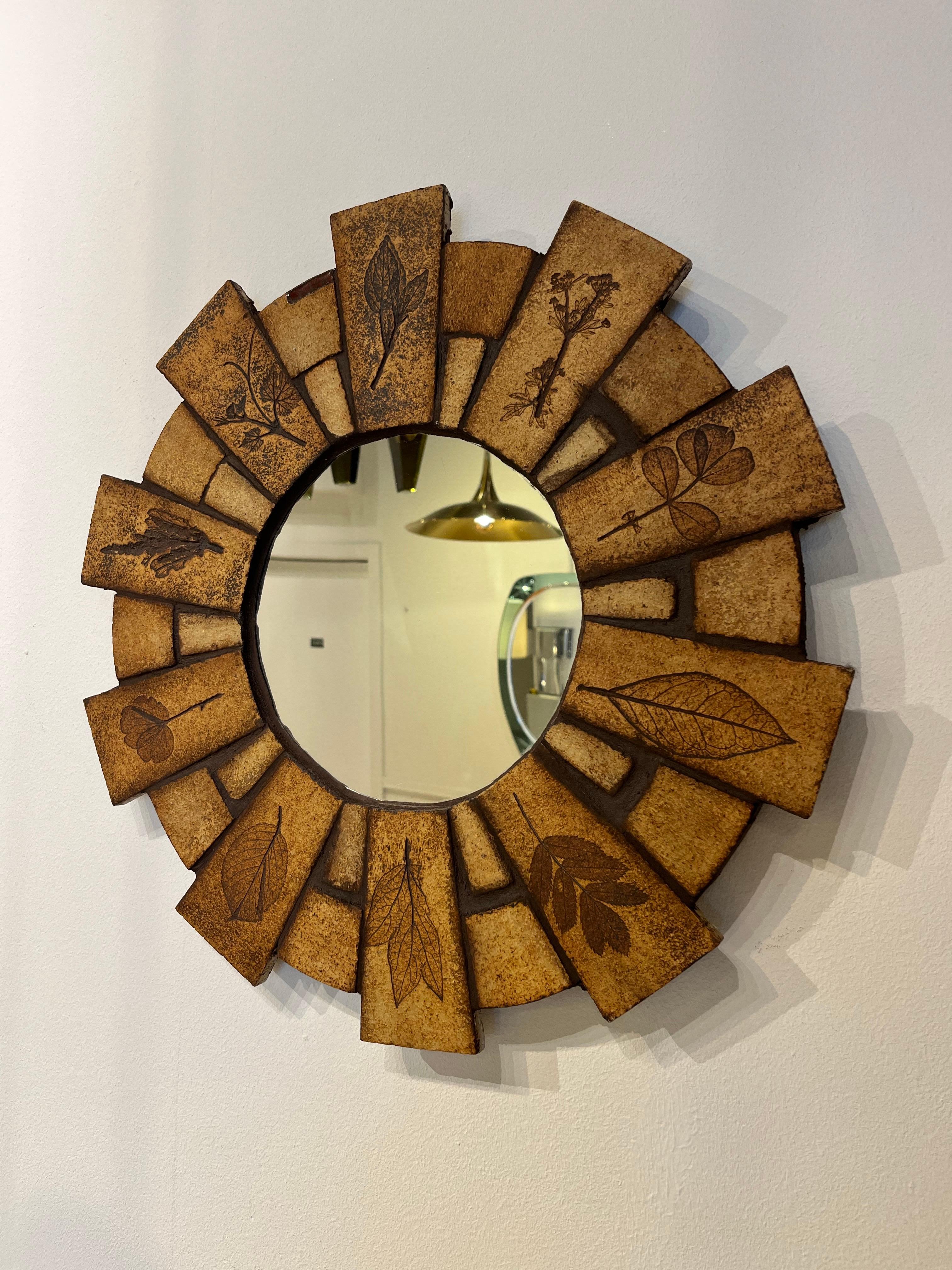 Roger Capron is a famous French ceramist who was active in the 1950s-1970s in Vallauris where he developed his style and workshop. Clearly influenced by nature. This mirror is from the series les 