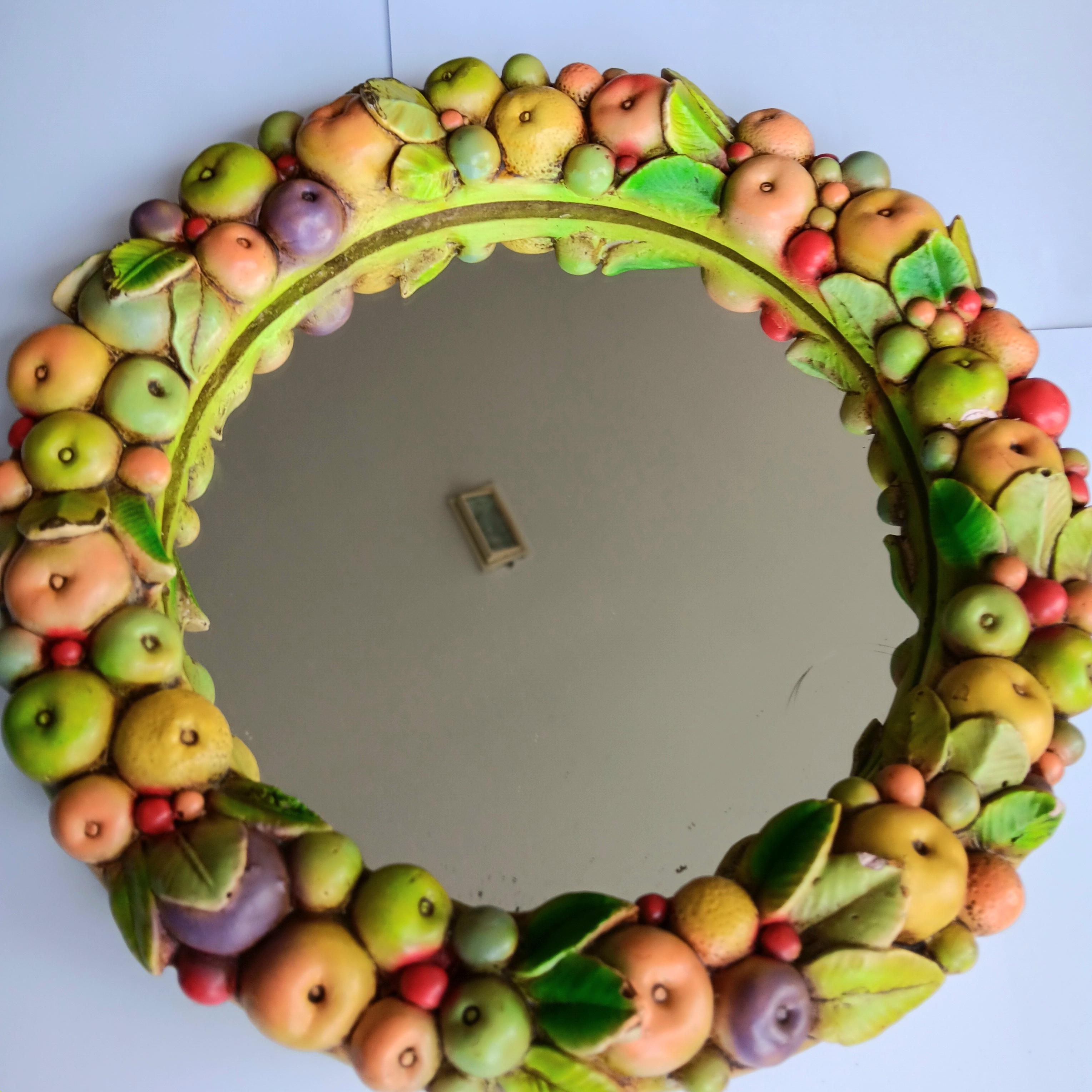 Last days!!!!
I accept reasonable offers on my entire catalog (small and medium-sized items only)

Ceramic Mirror Fruit Wreath with Beautiful Colors, Italy

Since it's a very unique piece, I couldn't tell its exact origin. It was purchased in Milan