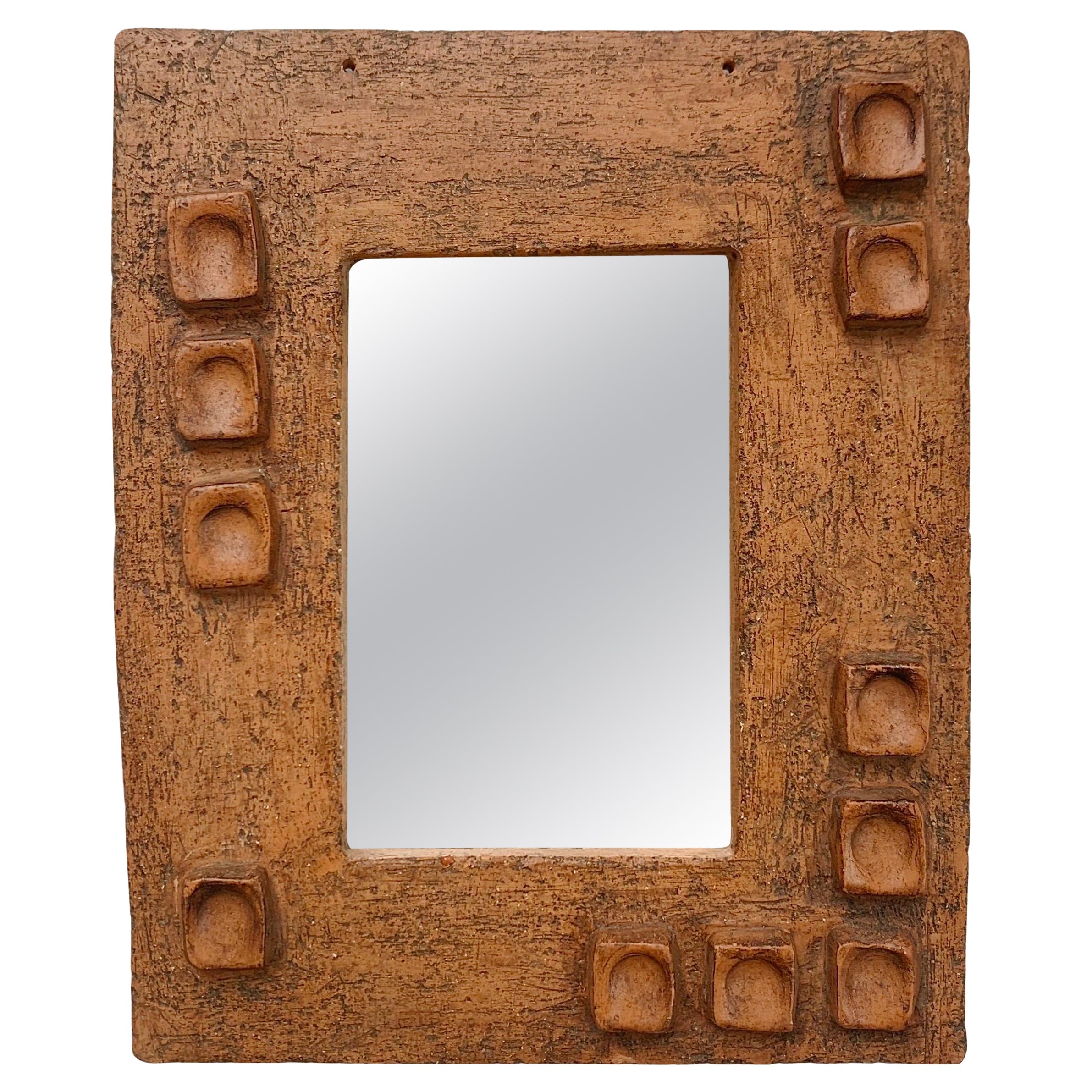 Mid-century ceramic mirror, Les Argonautes era, circa 1950, France.
Beautiful work of the terracotta color ceramic, original patina, original mirror.
Two holes at the top to put a rope.
Dimensions: 27 cm H, 23 cm W, 2 cm D.
Good condition.
All