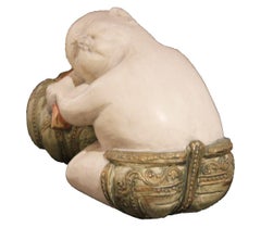 Ceramic Monk Sleeping on a Pouf