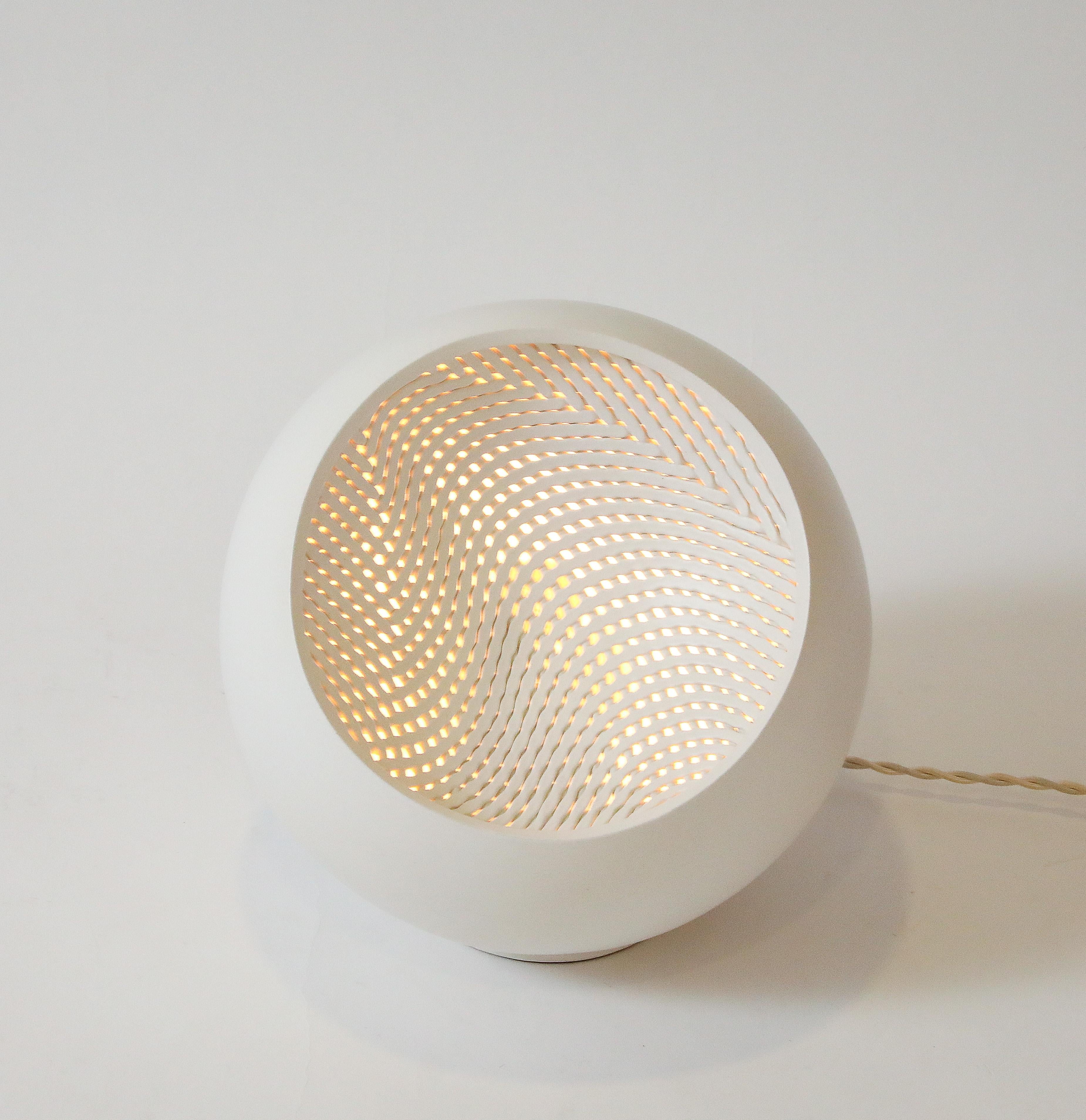 Low fire white stoneware, finished in satin warm white glaze.  Woven face optional: convex / concave. 
Signed 

