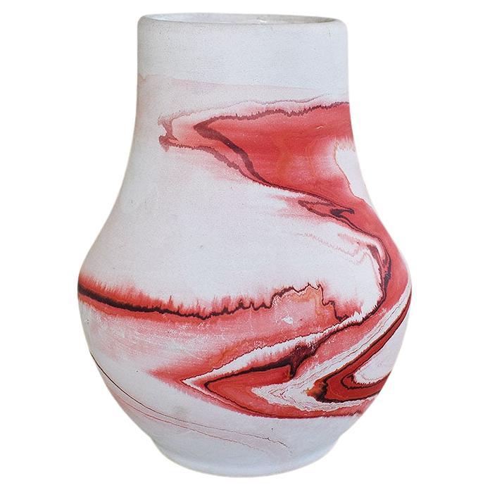 A beautiful Native American ceramic nemadji vase. Marbled in unglazed red and cream, this will be a beautiful piece to add to a current collection. It is glazed on the inside, making it a great piece to use as a vase with water. 

Dimensions:
7
