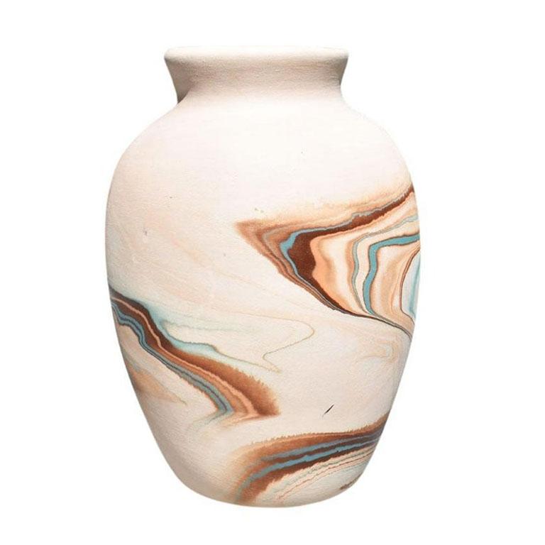 A beautiful ceramic nemadji vase. Marbled in unglazed turquoise, brown, and orange, this will be a beautiful piece to add to a current collection. 

Dimensions:
7