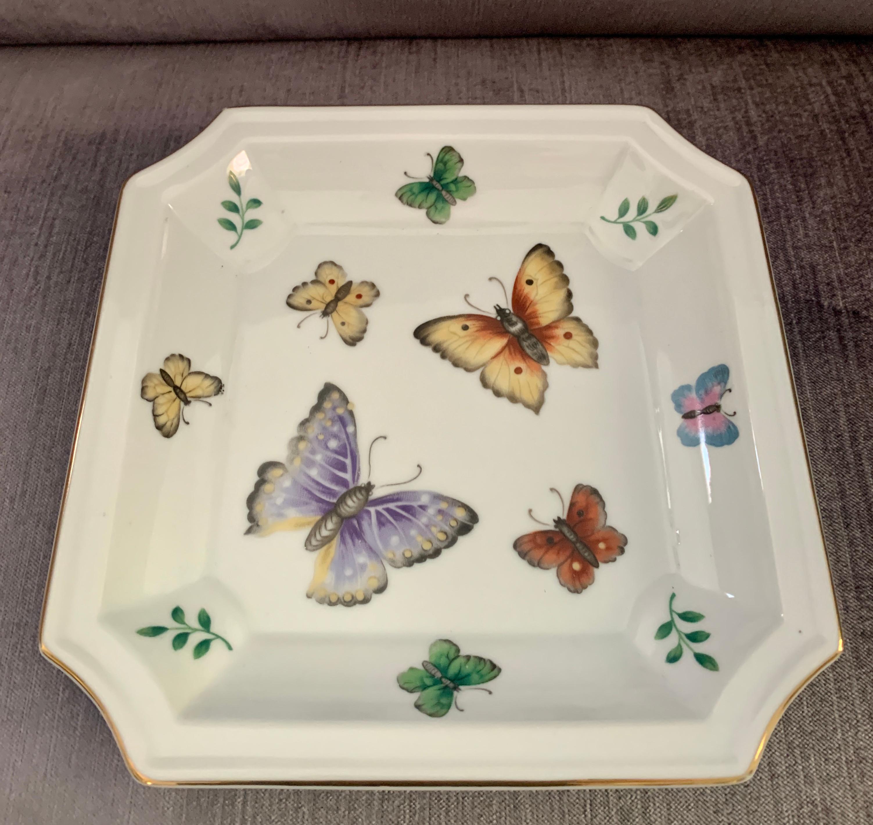 Nut or candy dish in the style of Lilly Pulitzer. The square dish has a wonderful Pullitzer style with an array of very popular butterflies. Also a compliment to any desk or front door as a catch all for mail or keys.