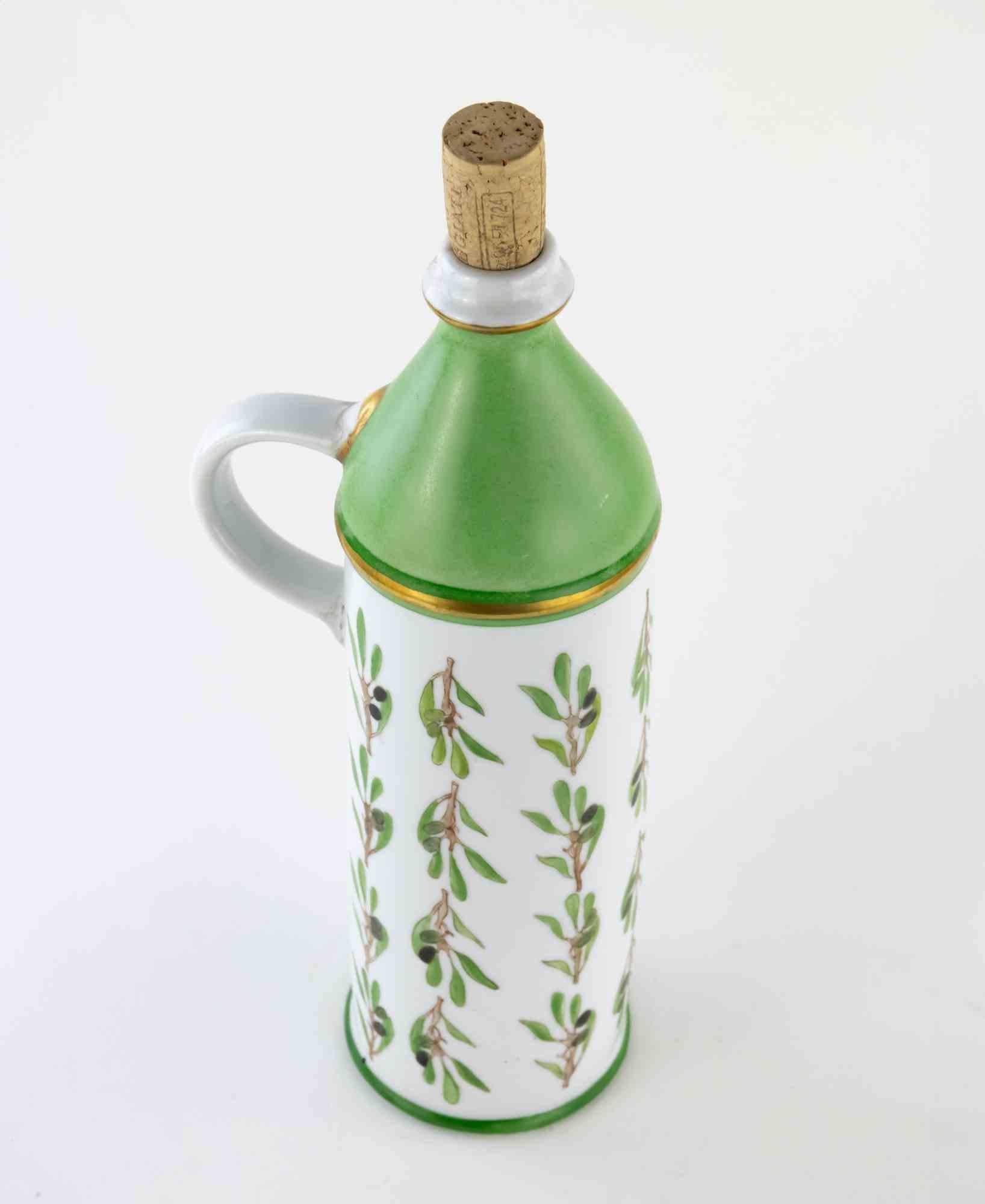 Ceramic oil bottle is a beautiful handmade object created in 1980s. 

30 x 8 x 12 cm ( with handle).

Dedication in French on the base of the bottle.

Very good conditions.

Collect this original object to furnish your home!