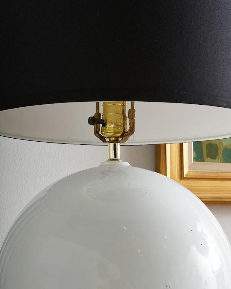 A fun 1970s table lamp in a beautiful and organic feeling spherical shape. The original finish has a slight sheen. This is perfect as an accent lamp on an entryway console or tabletop.  Lampshade not included.

Dimensions: 16