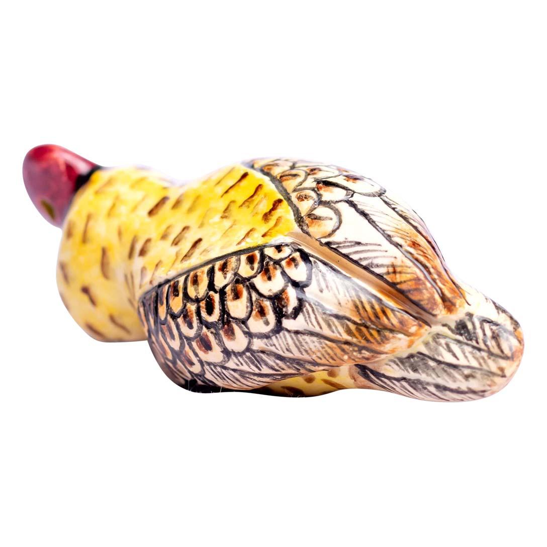 This ceramic owl ornament, crafted in South Africa by Zimele Ceramics, is a beautifully hand-sculpted and painted piece by artisan Nokubonga. Standing at 3 inches high, 1 inch in length, and 2 inches wide, this owl is delicate yet full of character.