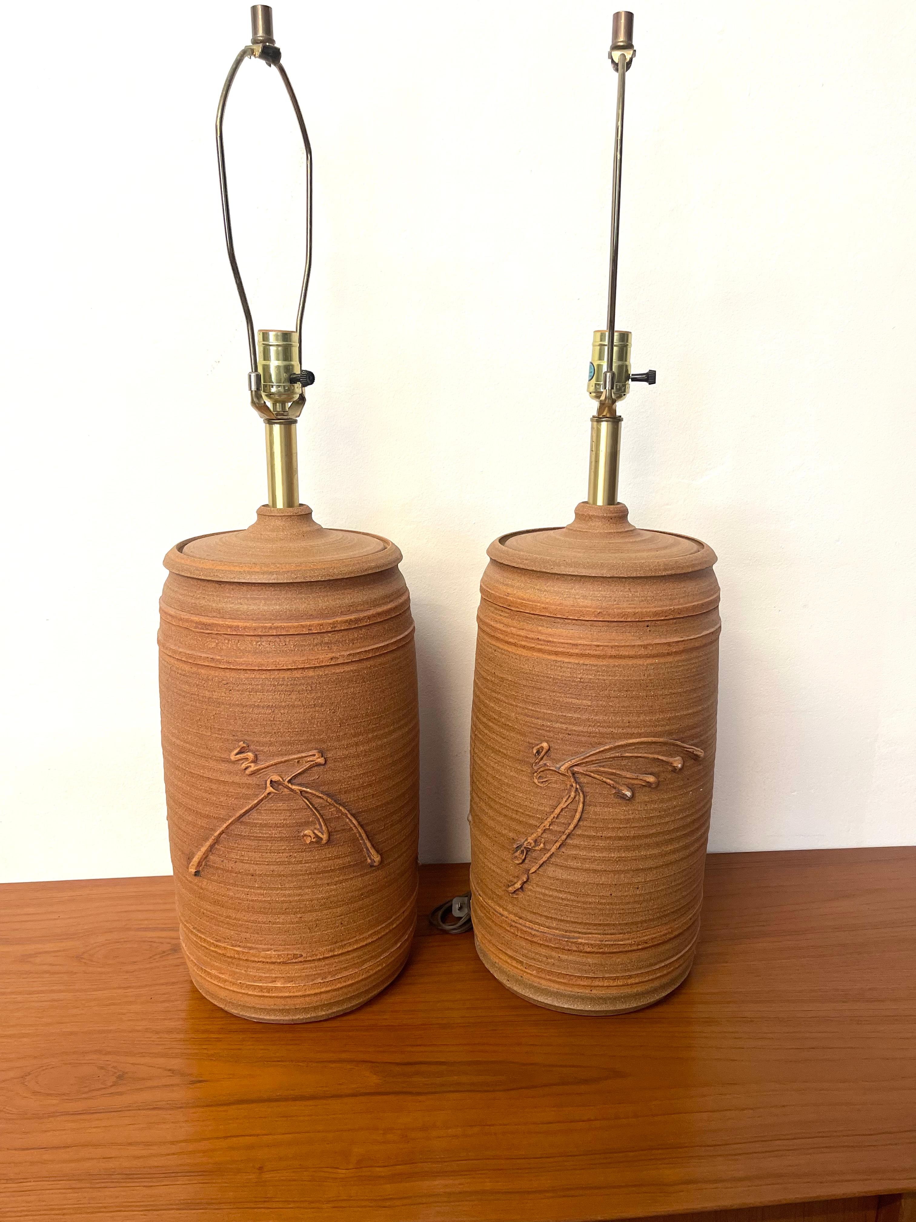 Amazing pair of mid-century brown ceramic table lamps by Bob Kinzie. They are original from the 1960s. They are in excellent condition. No broken or damages. The light works great and there are no shade lamps. Great room accent pieces.