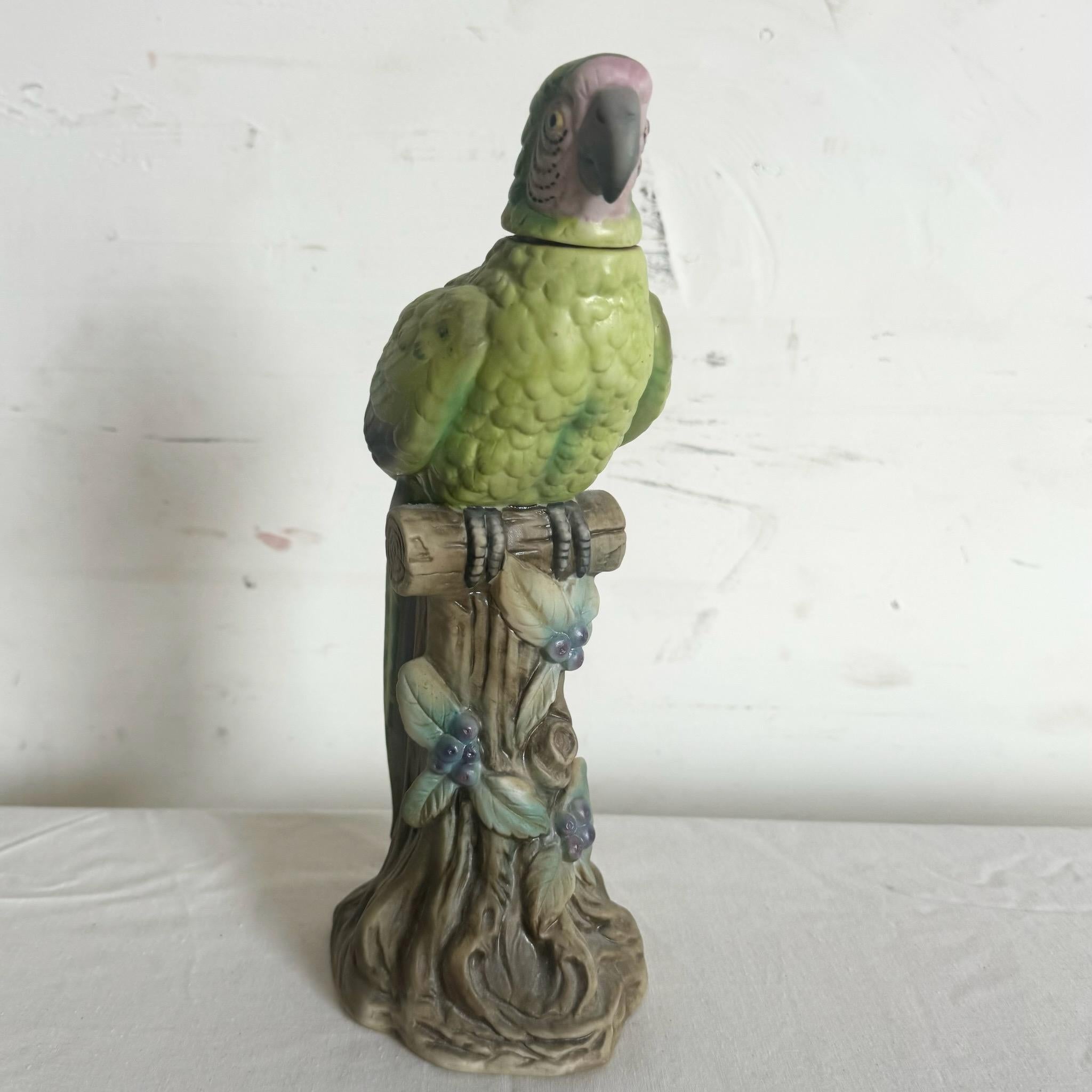Brighten your space with this charming ceramic parrot d√©cor bottle by Arnart Imports, created by Banfi Productions. This beautifully crafted piece features vibrant colors and intricate detailing, making it perfect as a decorative accent or unique