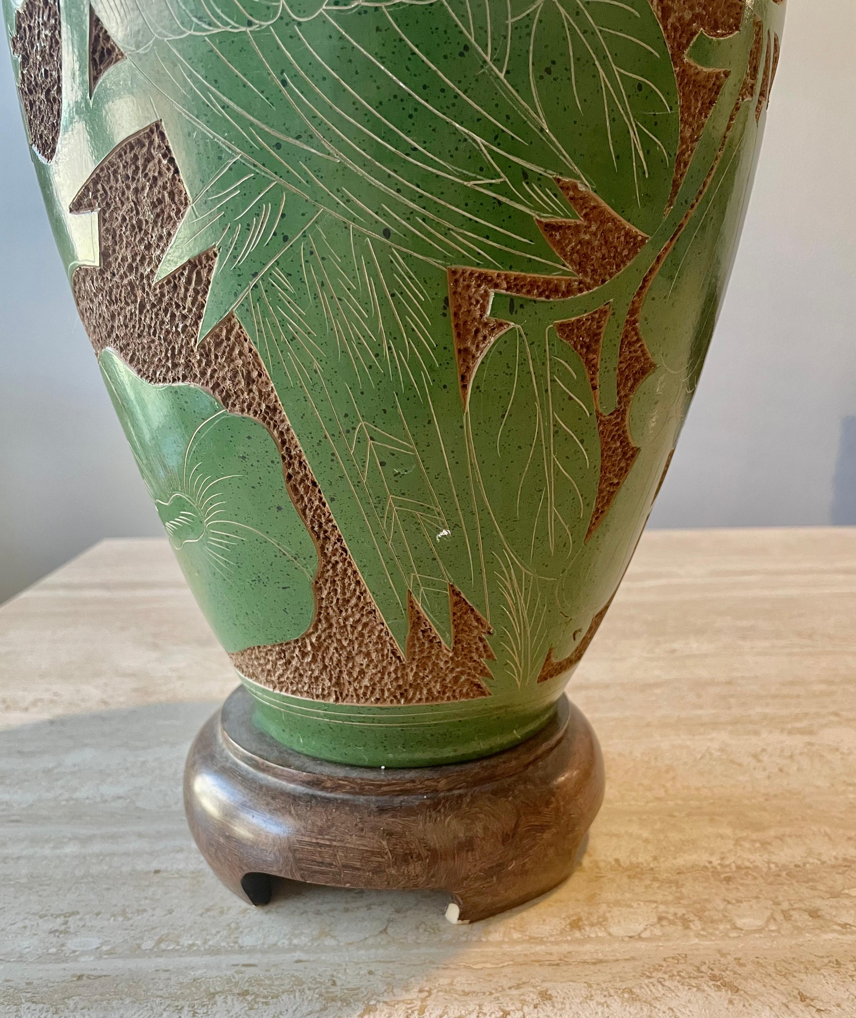 Green ceramic and wood parrot lamp.