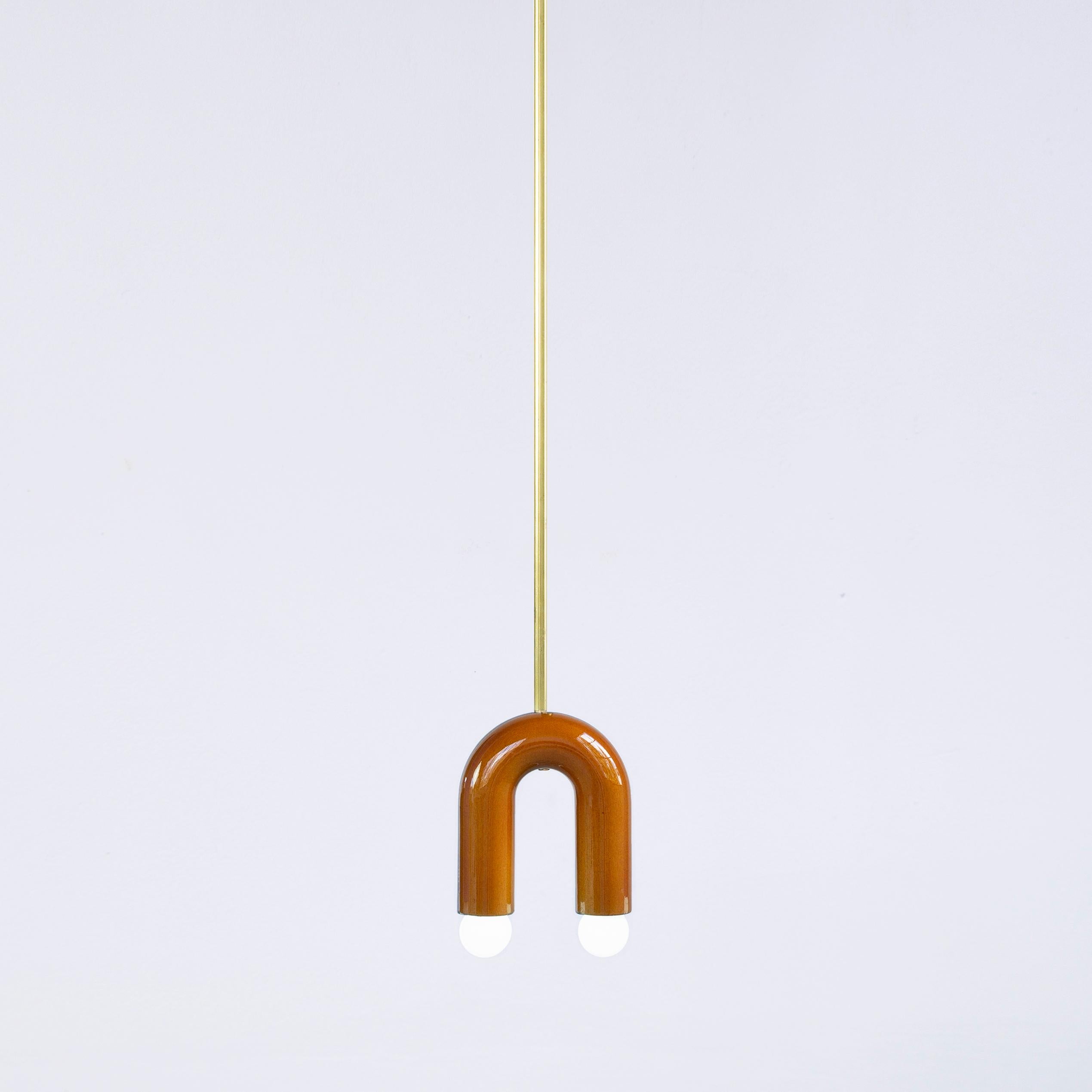 TRN A1 Pendant lamp / ceiling lamp / chandelier
Designer: Pani Jurek

Model shown: Ochre
Dimensions: H 17.5 x 15 x 5 cm

Bulb (not included): E27/E26, compatible with US electric system

Materials: Hand glazed ceramic and brass
Rod: brass, length