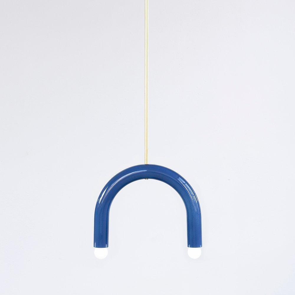 TRN B1 Pendant lamp / ceiling lamp / chandelier 
Designer: Pani Jurek

Dimensions: H 27.5 x 35 x 5 cm
Model shown: Medium blue 

Bulb (not included): E27/E26, compatible with US electric system

Materials: Hand glazed ceramic and brass
Rod: brass,