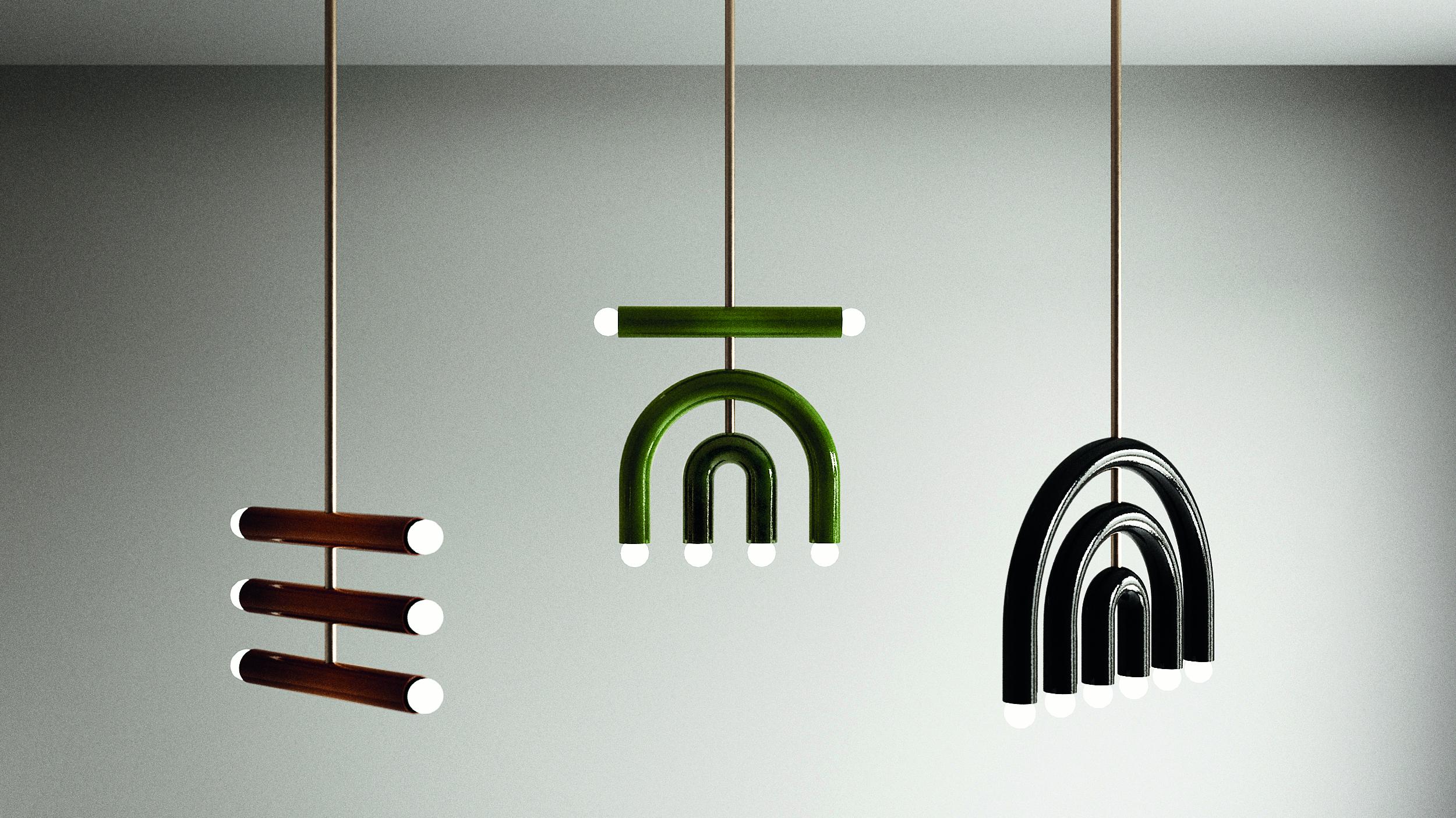 TRN C4 Pendant lamp / ceiling lamp / chandelier 
Designer: Pani Jurek

Dimensions: H 25 x 35 x 5 cm
Model shown: Black, ochre & green

Bulb (not included): E27/E26, compatible with US electric system

Materials: Hand glazed ceramic and brass
Rod: