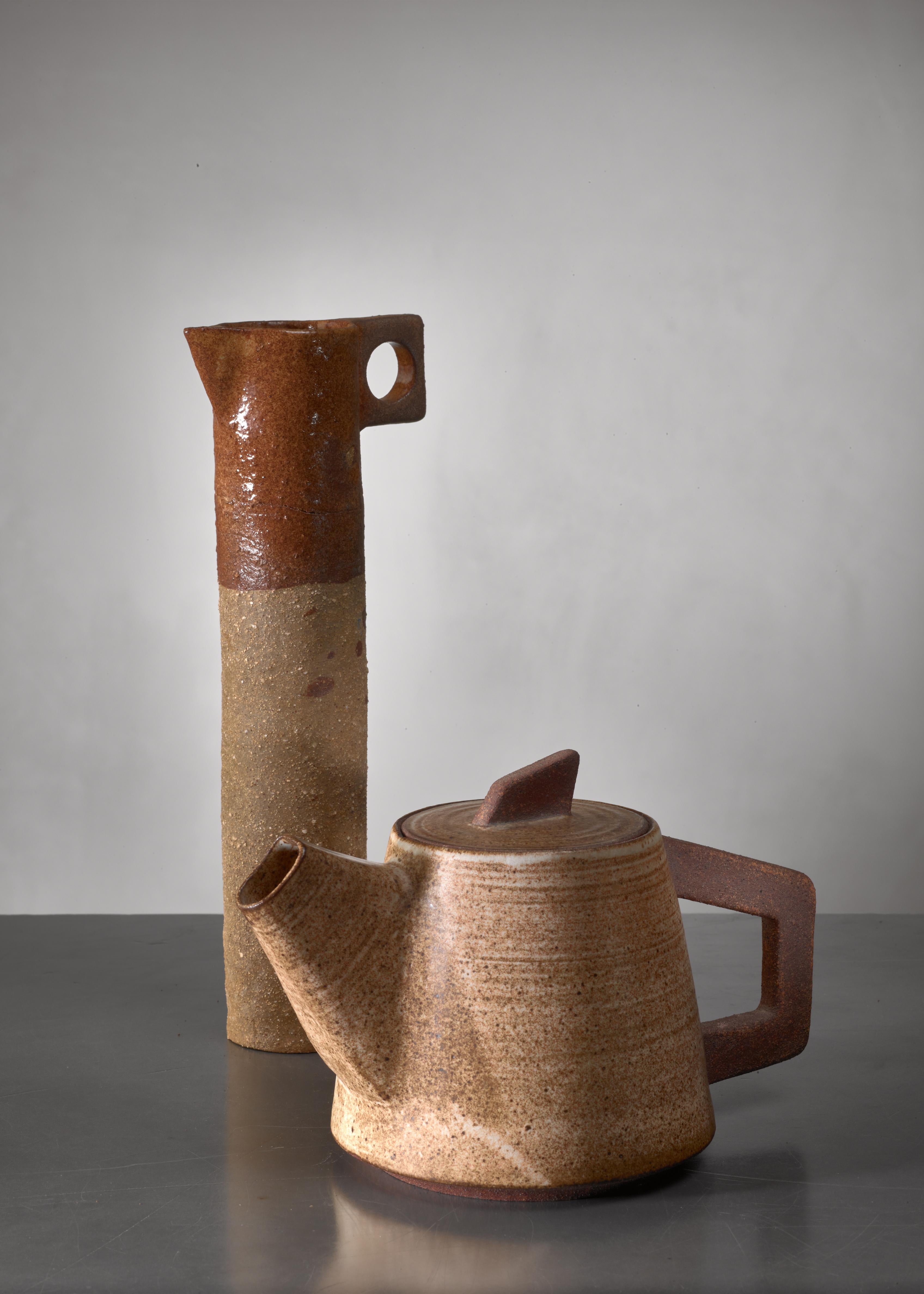 A thin ceramic pitcher and pot from France. A beautiful decorative set. 

The measurements stated are of the pitcher.
   
